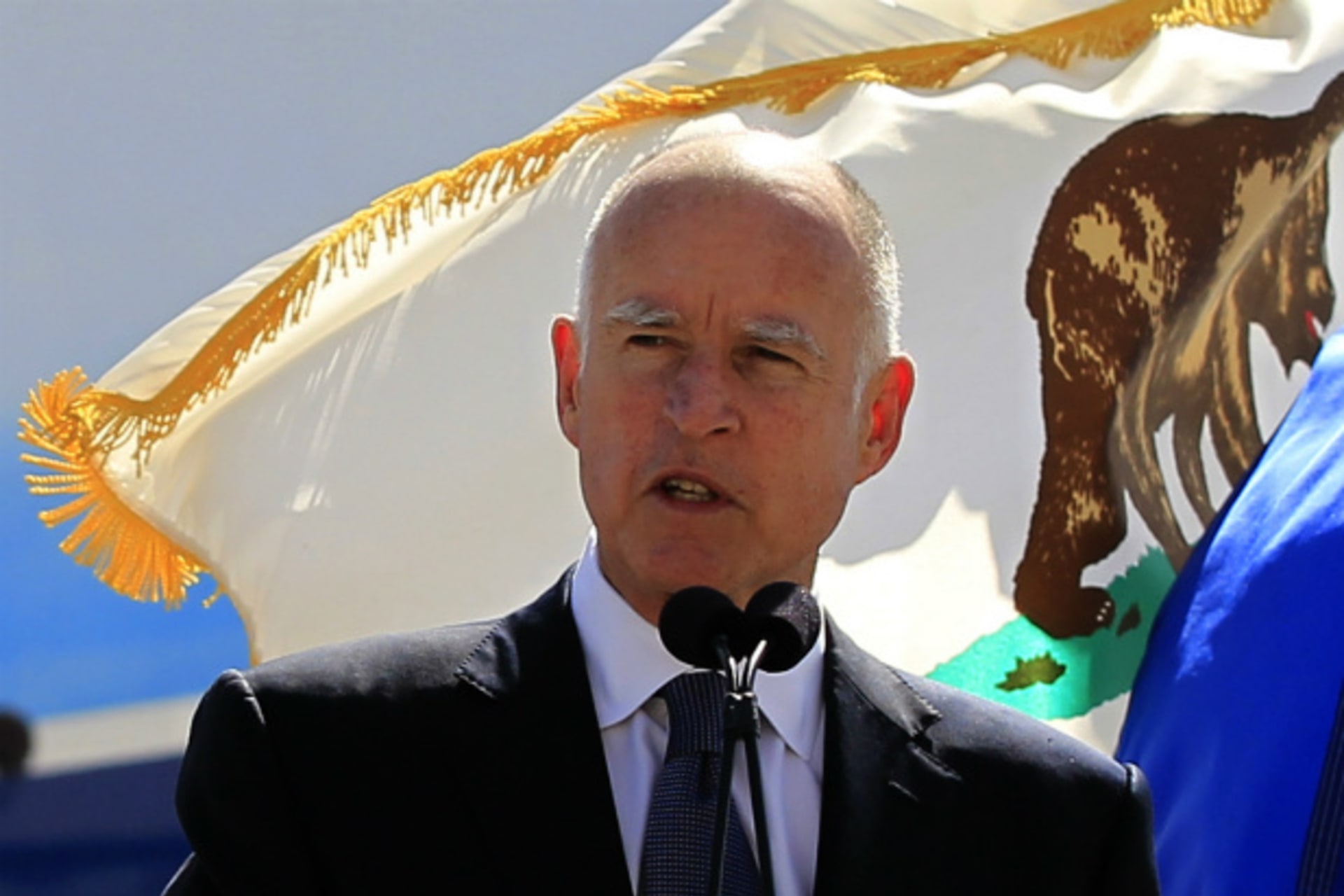 <p>California Governor Jerry Brown speaks in front of a California flag in Long Beach, California on March 14, 2012. (Lucy Nicholson/Courtesy Reuters)</p>
