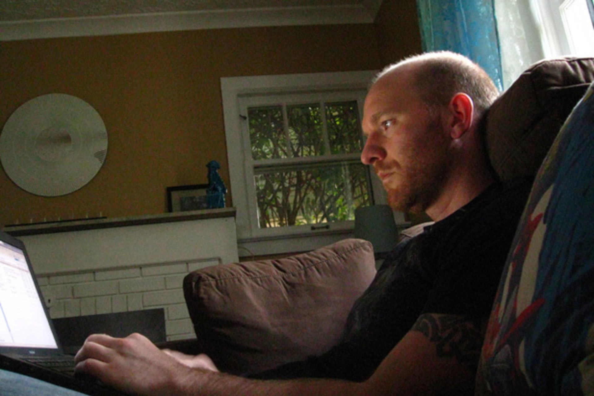 <p>A man at home on his laptop. (eyeliam/Flickr)</p>
