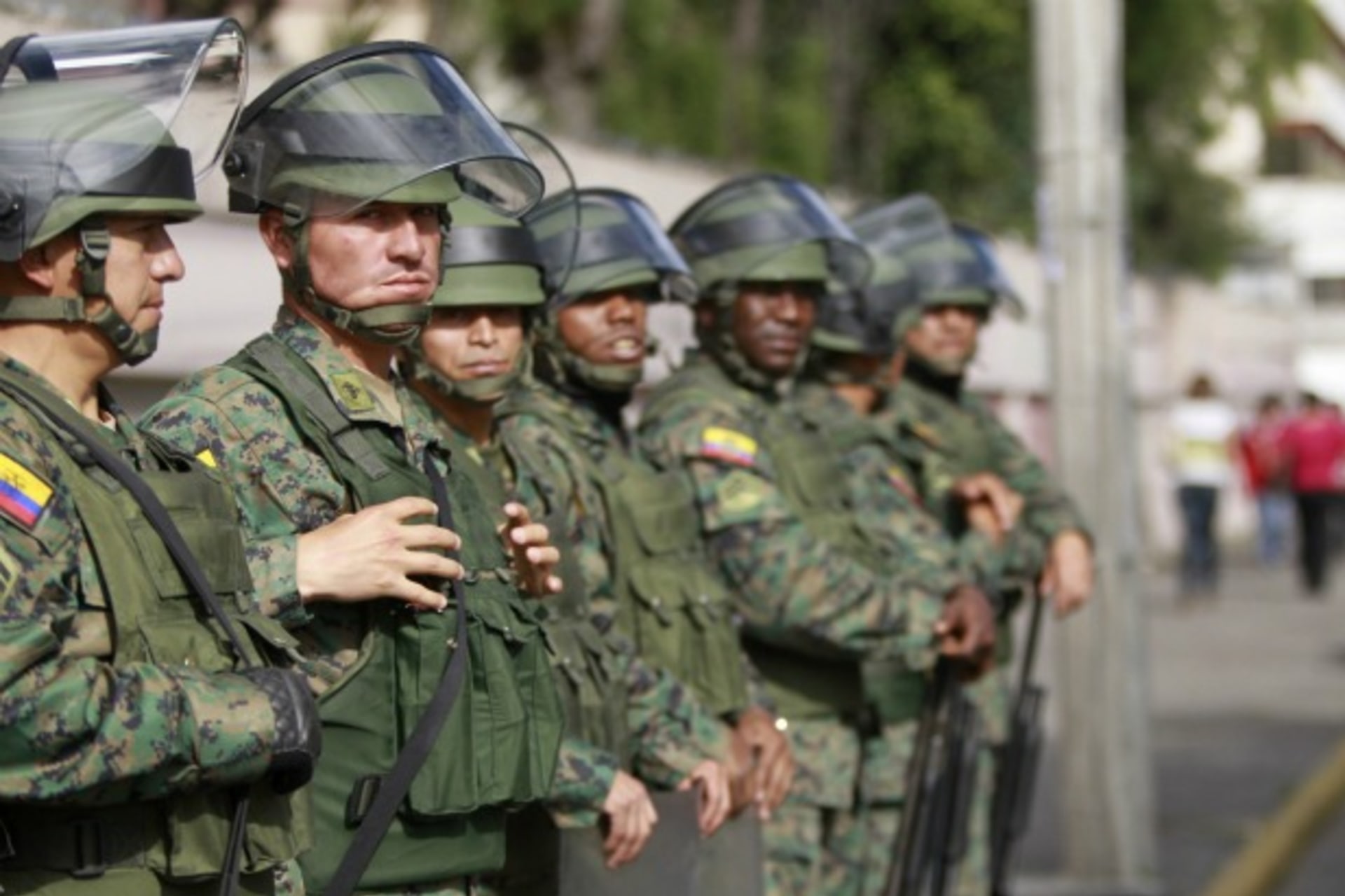 <p>Soldiers stand guard outside Eufrasia high school in Quito (Guillermo Granja/Courtesy Reuters).</p>
