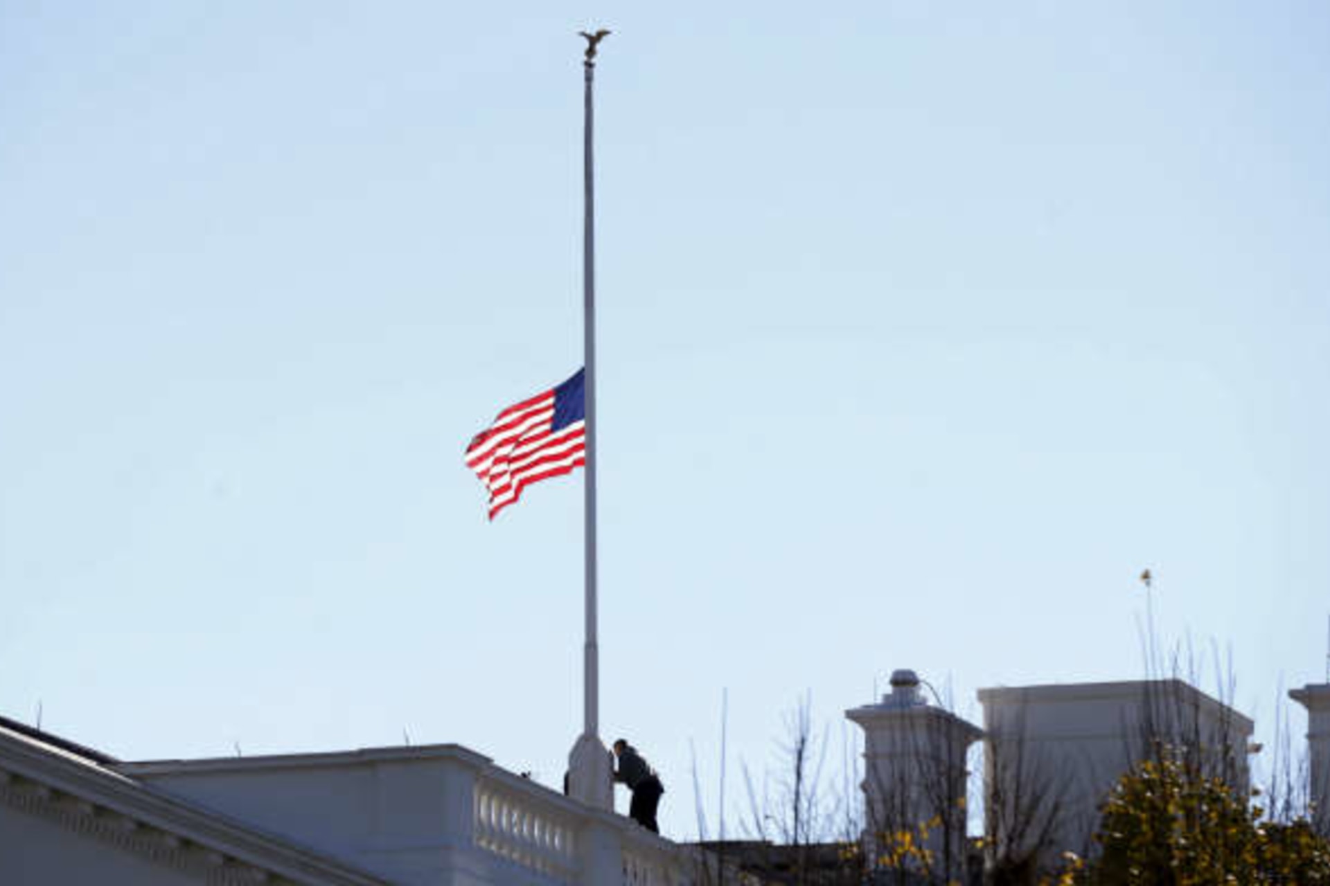 <p>The flag over the White House is lowered to half staff to honor the victims of the San Bernardino, California shootings. (Kevin Lamarque/Courtesy Reuters)</p>
