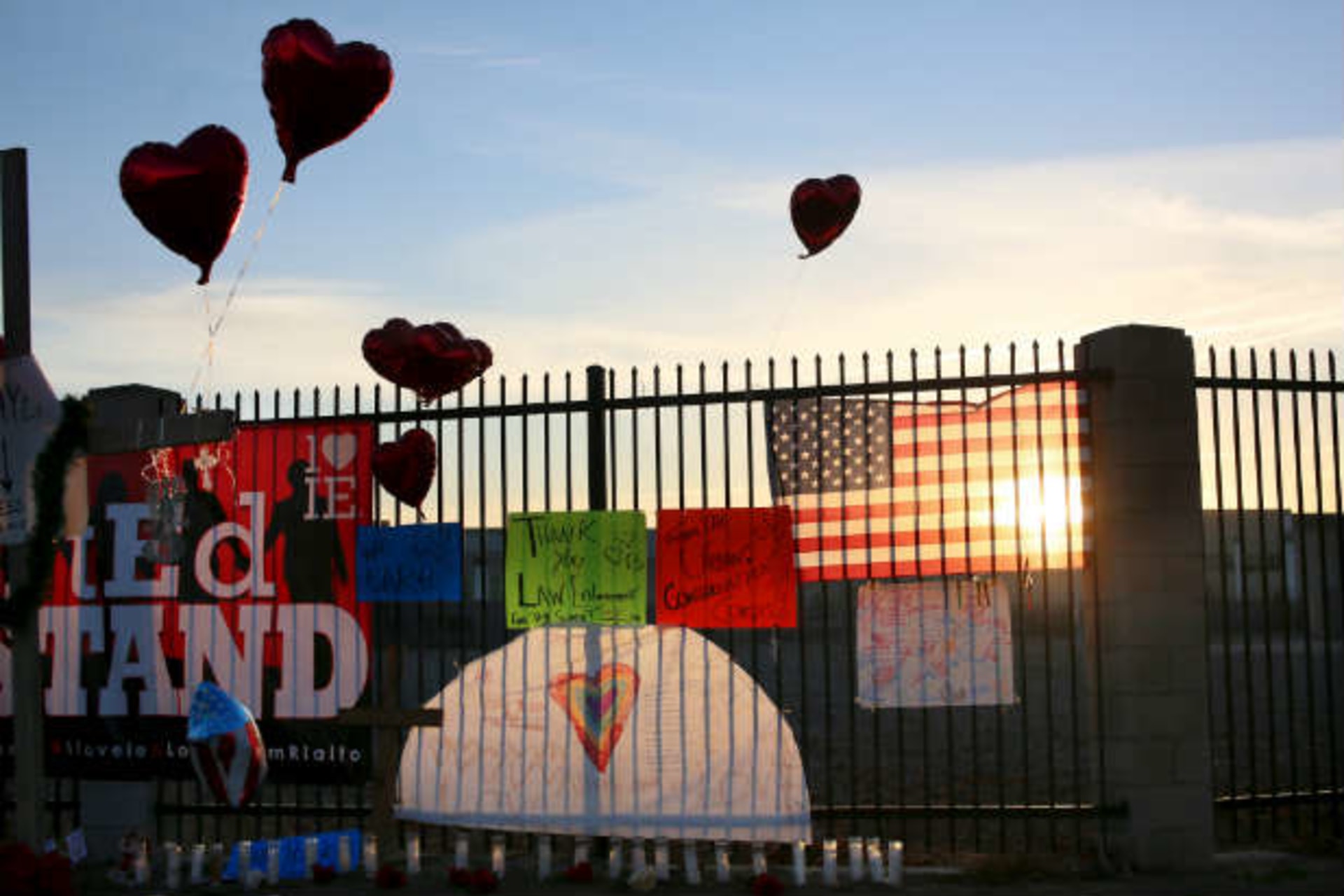 <p>Mementos adorn a shrine to the victims of the San Bernardino attack. (Sandy Huffaker/Courtesy Reuters)</p>