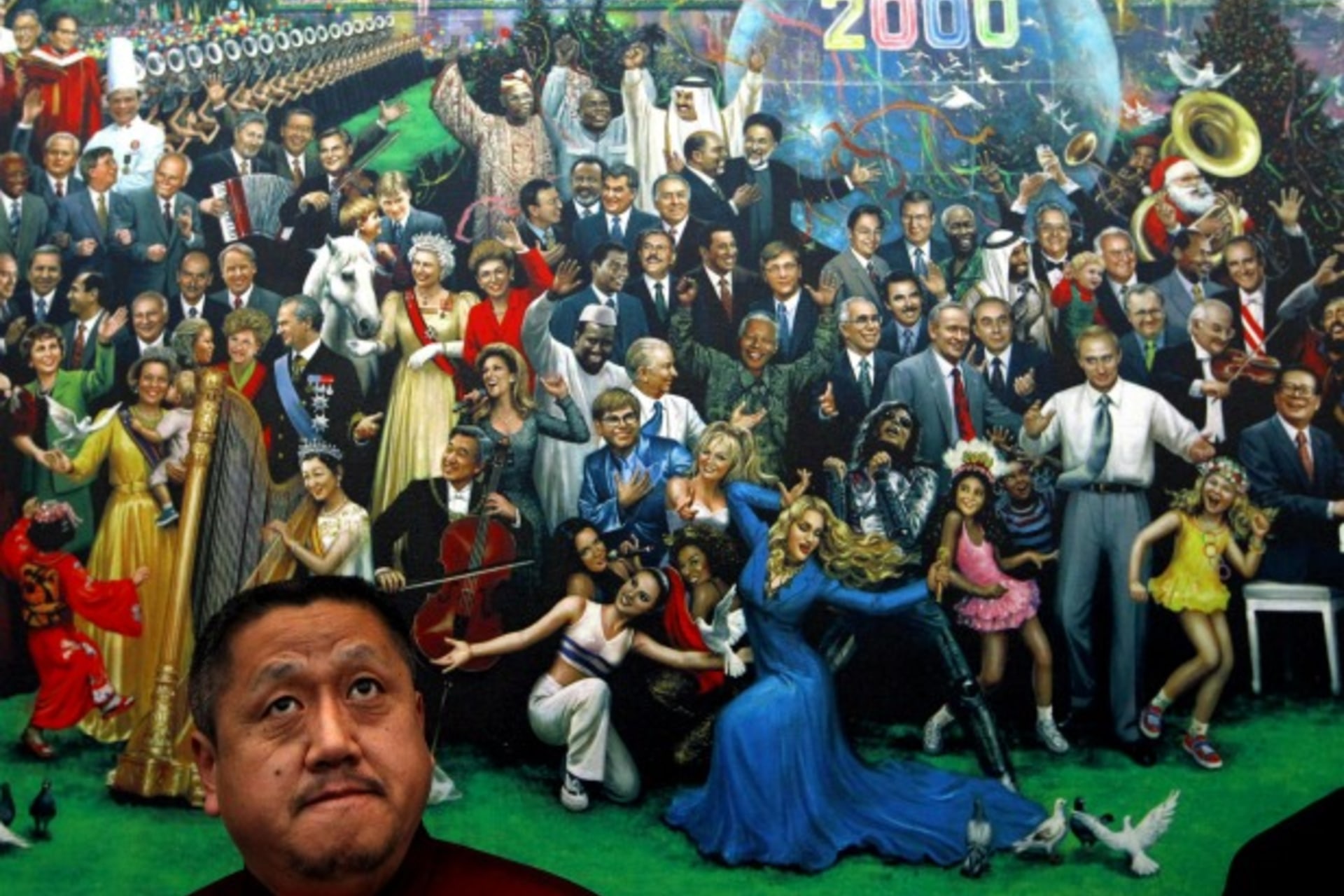 <p>Kong Qingdong, a direct descendant of the Chinese philosopher Confucius, stands in front of a painting depicting celebrities a…cluding a dancing Russian Prime Minister Vladimir Putin, at the Confucius Peace Prize ceremony in Beijing on December 9, 2011.</p>
