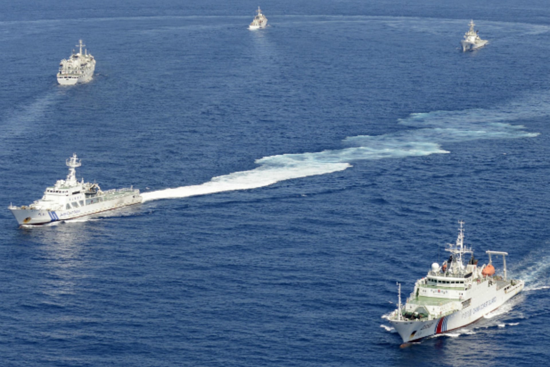 <p>Vessels from the China Maritime Surveillance and the Japan Coast Guard are seen near disputed islands, called Senkaku in Japan and Diaoyu in China, in the East China Sea, in this photo taken on September 10, 2013. (Kyodo/Courtesy Reuters)</p>
