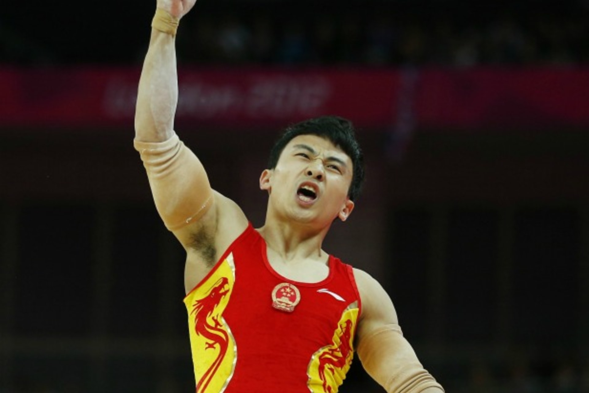 <p>China’s Feng Zhe, the eventual gold medal winner, reacts after competing in the men’s gymnastics parallel bars final during the London 2012 Olympic Games on August 7, 2012.</p>
