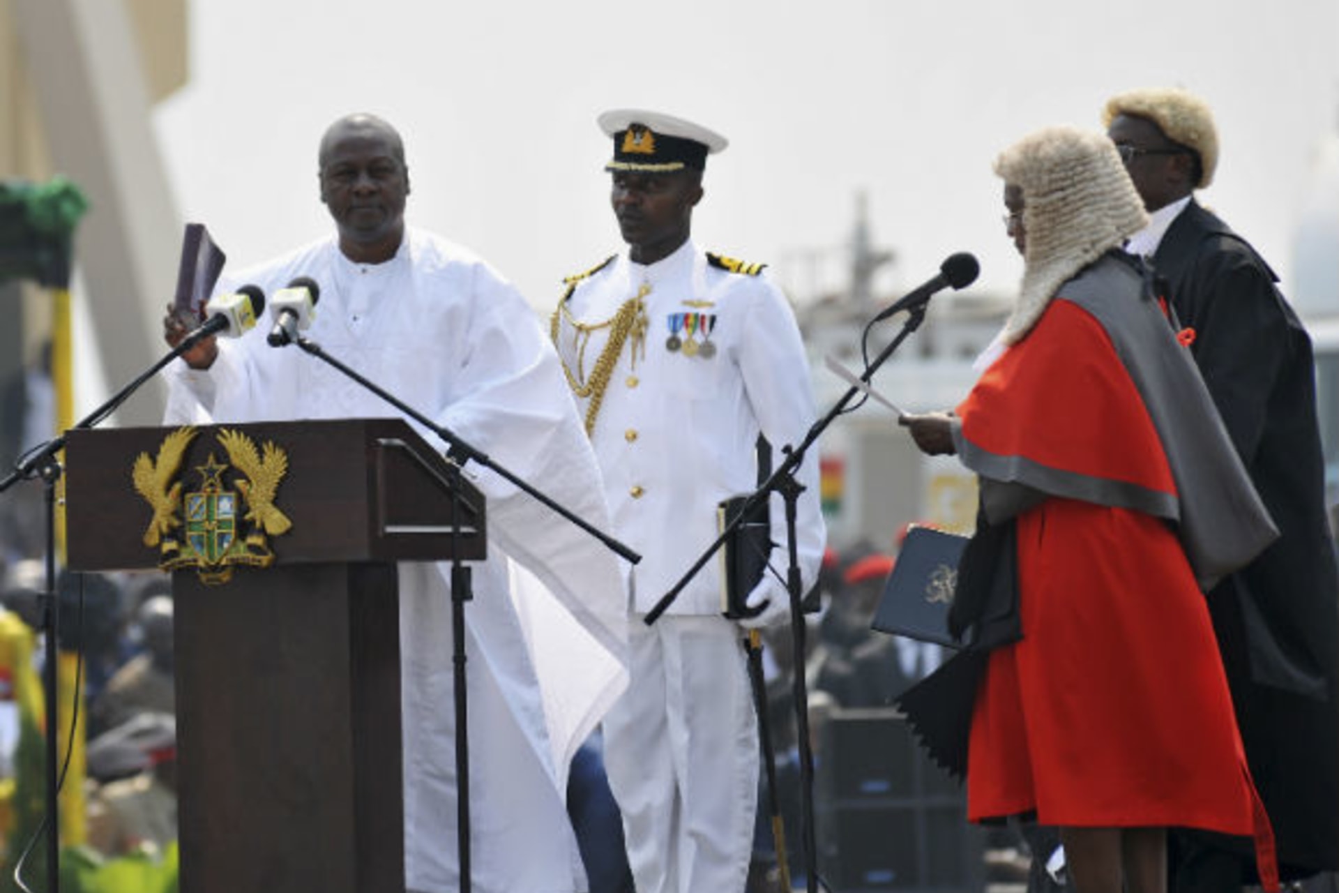 Ghanaian President John Dramani Mahama (L) takes the oath during his inauguration ceremony at the Independence Square in Accra January 7, 2013.