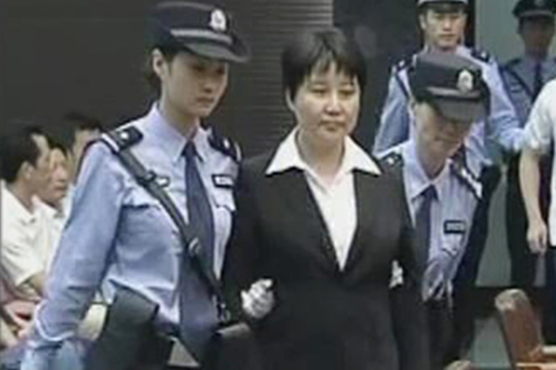 <p>Gu Kailai, wife of ousted Chinese Communist Party Politburo member Bo Xilai, attends a trial in the court room at Hefei Intermediate People’s Court in this still image taken from video</p>
