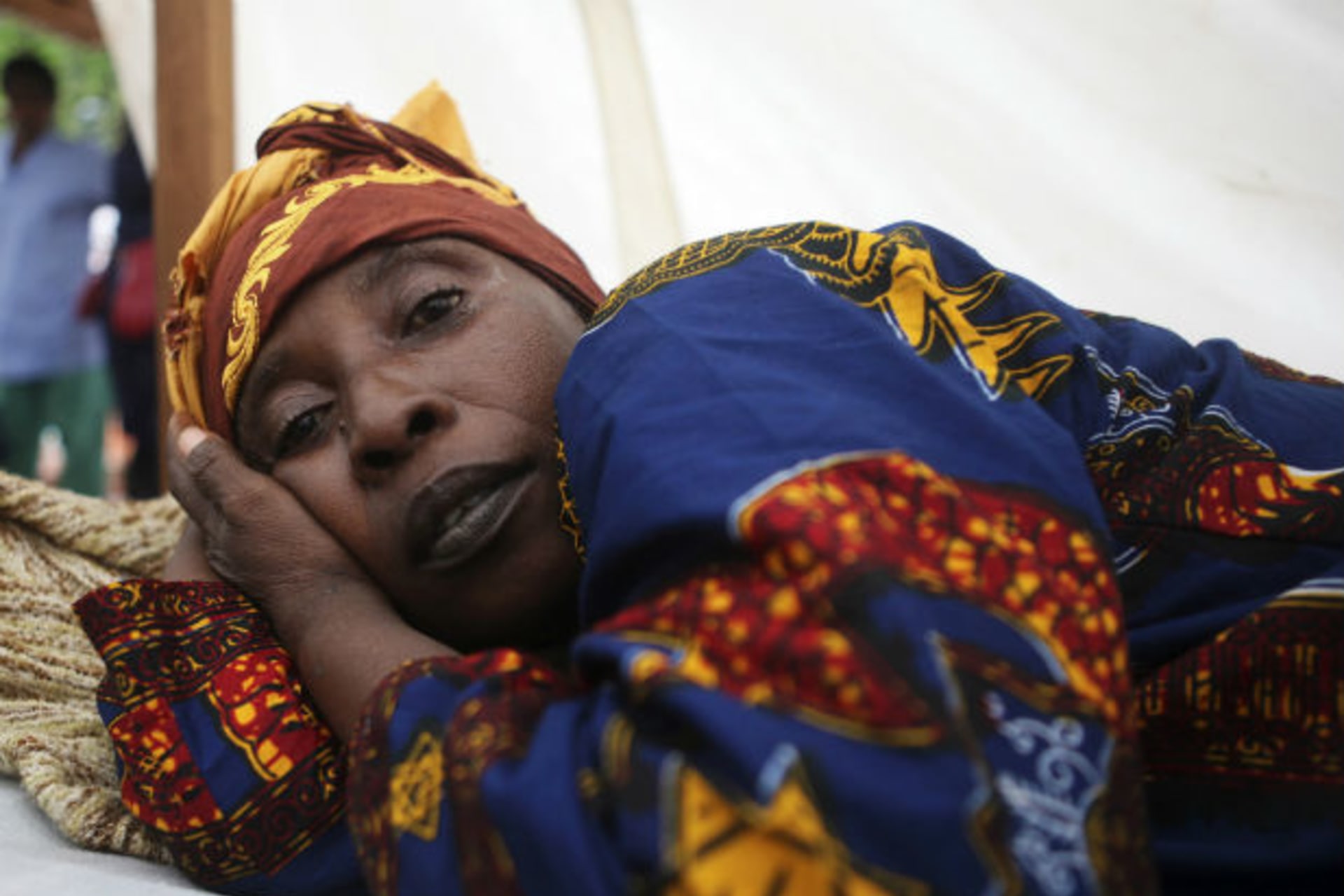 A cholera patient lies in a treatment centre run by Medecins Sans Frontieres on Macauley Street in Sierra Leone's capital Freetown, August 23, 2012.