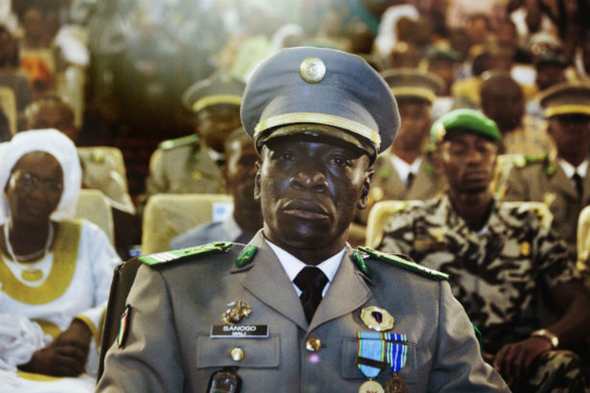 Coup leader Captain Amadou Sanogo attends a ceremony as former parliament speaker Dioncounda Traore (unseen) is sworn in as Mali's interim president in the captial Bamako, April 12, 2012.