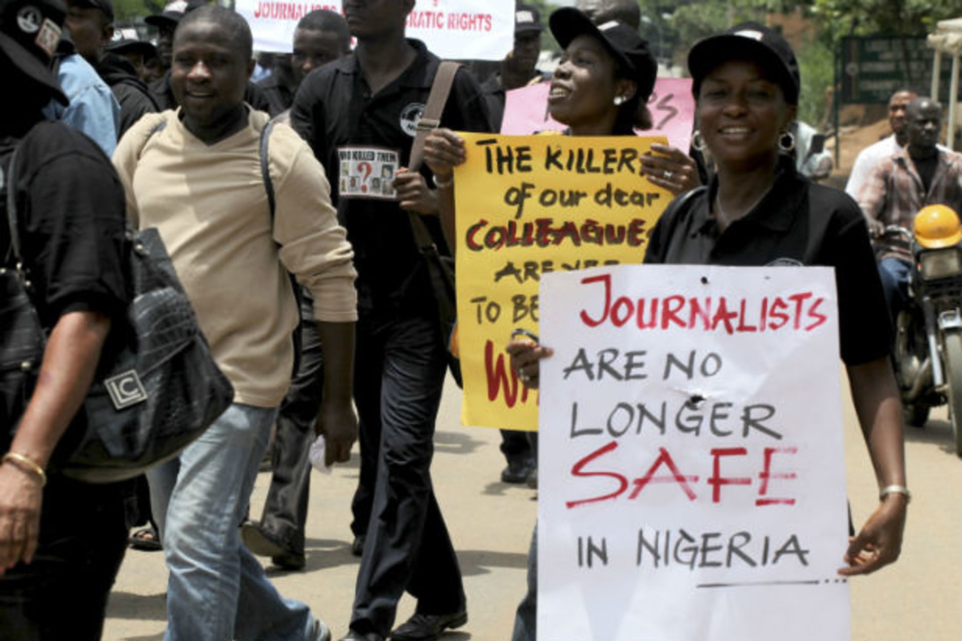 Journalists carry placards along a street during a protest to mark World Press Freedom day in Nigeria's commercial capital Lagos, May 3, 2010.