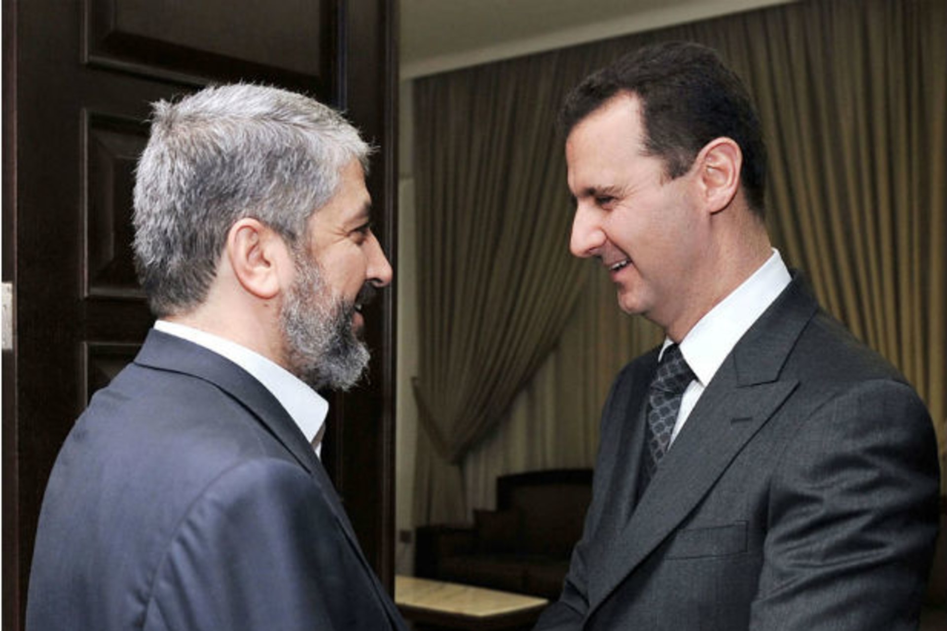 Syria's president Bashar al-Assad shakes hands and welcomes Hamas leader Khaled Meshal before a meeting in Damascus on January 24, 2009—three years before Meshal would break with the former (Courtesy Reuters).