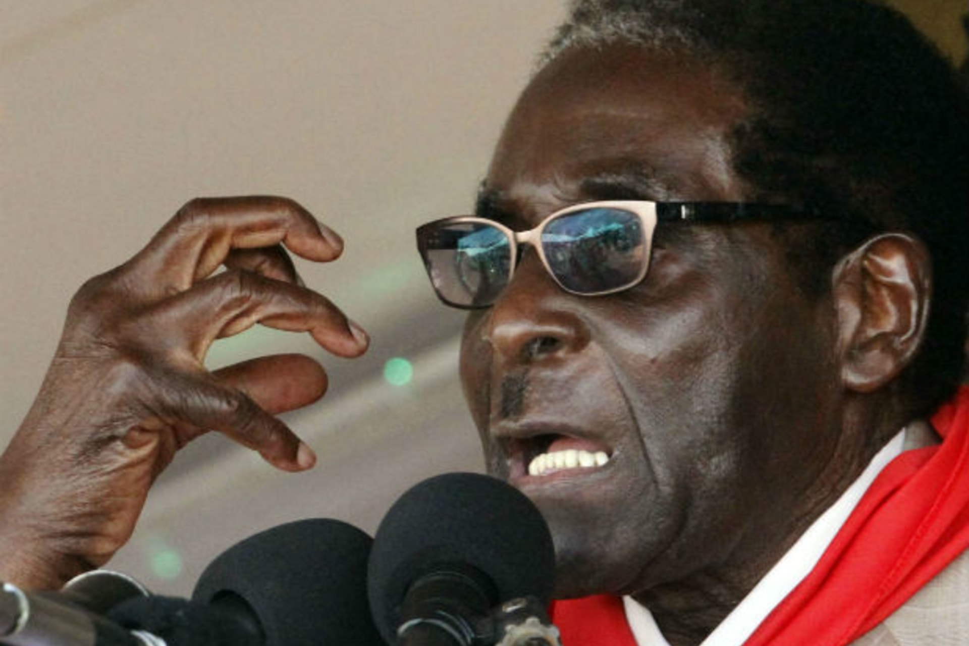 Zimbabwe's President Robert Mugabe gestures as he speaks during an event marking his 89th birthday at Chipadze stadium in Bindura, about 90 km (56 miles) north of the capital Harare March 2, 2013.