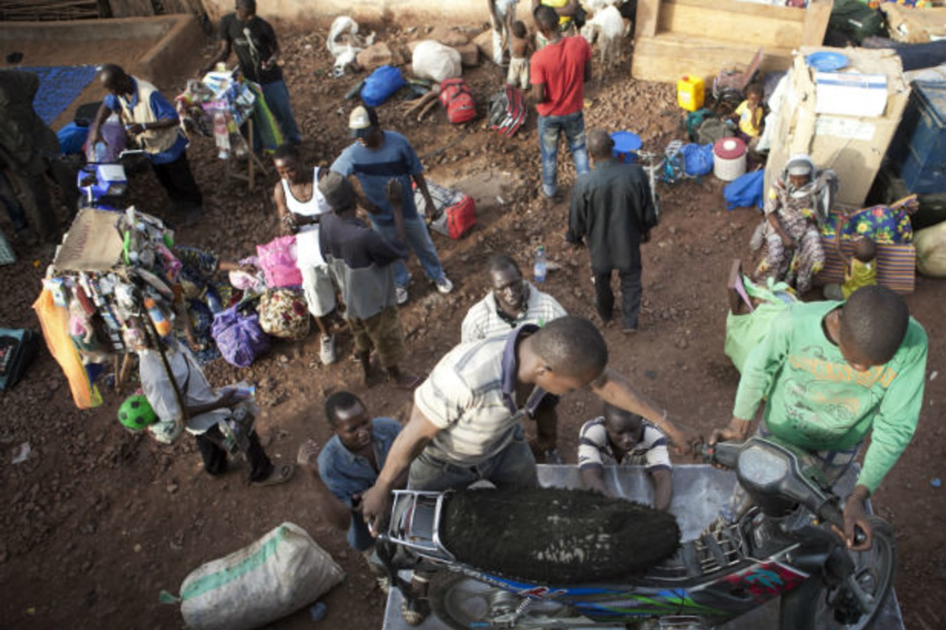 Malians who fled unrest in the rebel-held northeastern cities of Gao and Timbuktu arrive by bus in the capital Bamako April 11, 2012.