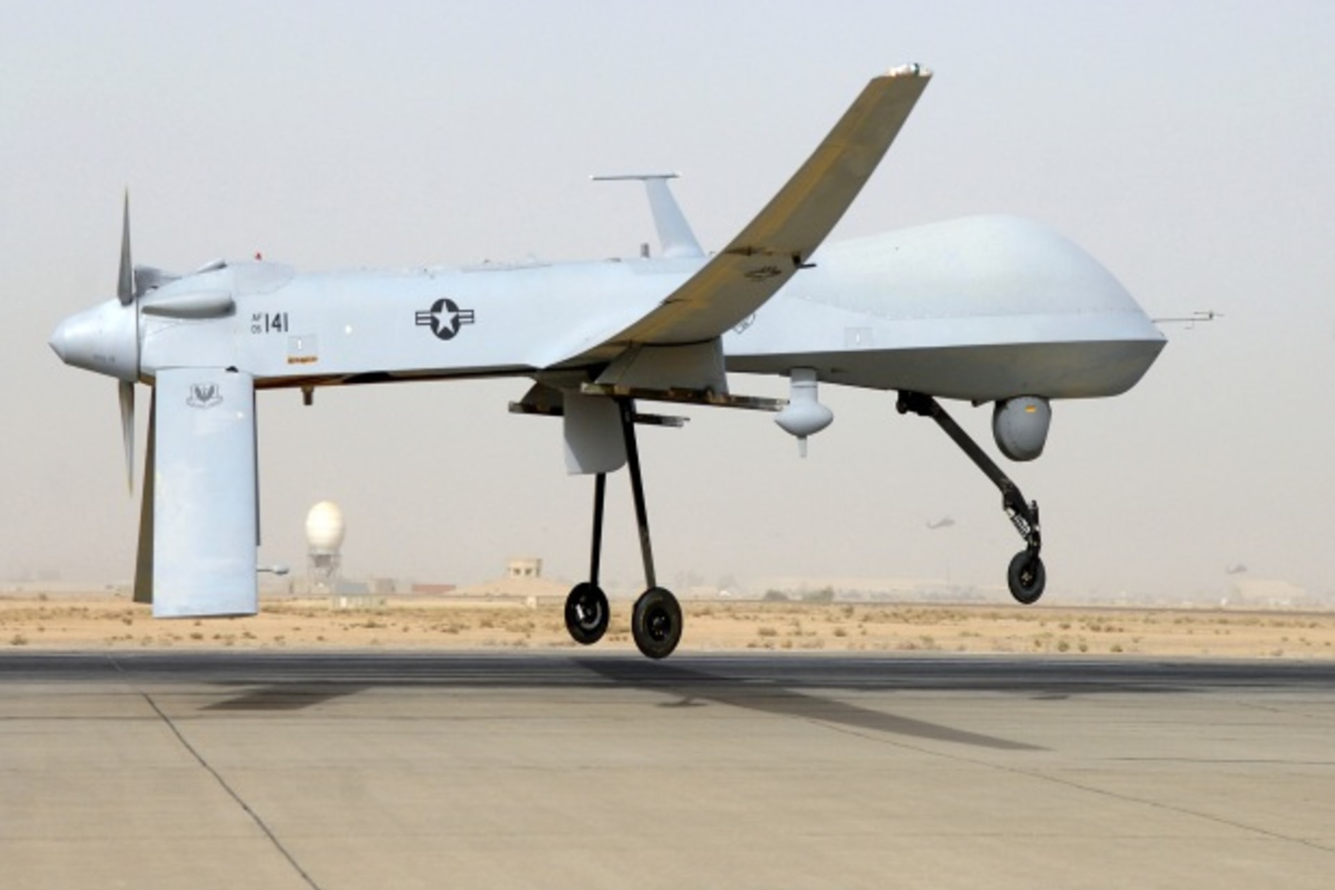 <p>A U.S. unmanned drone hovers over the tarmac (Handout/Courtesy Reuters).</p>
