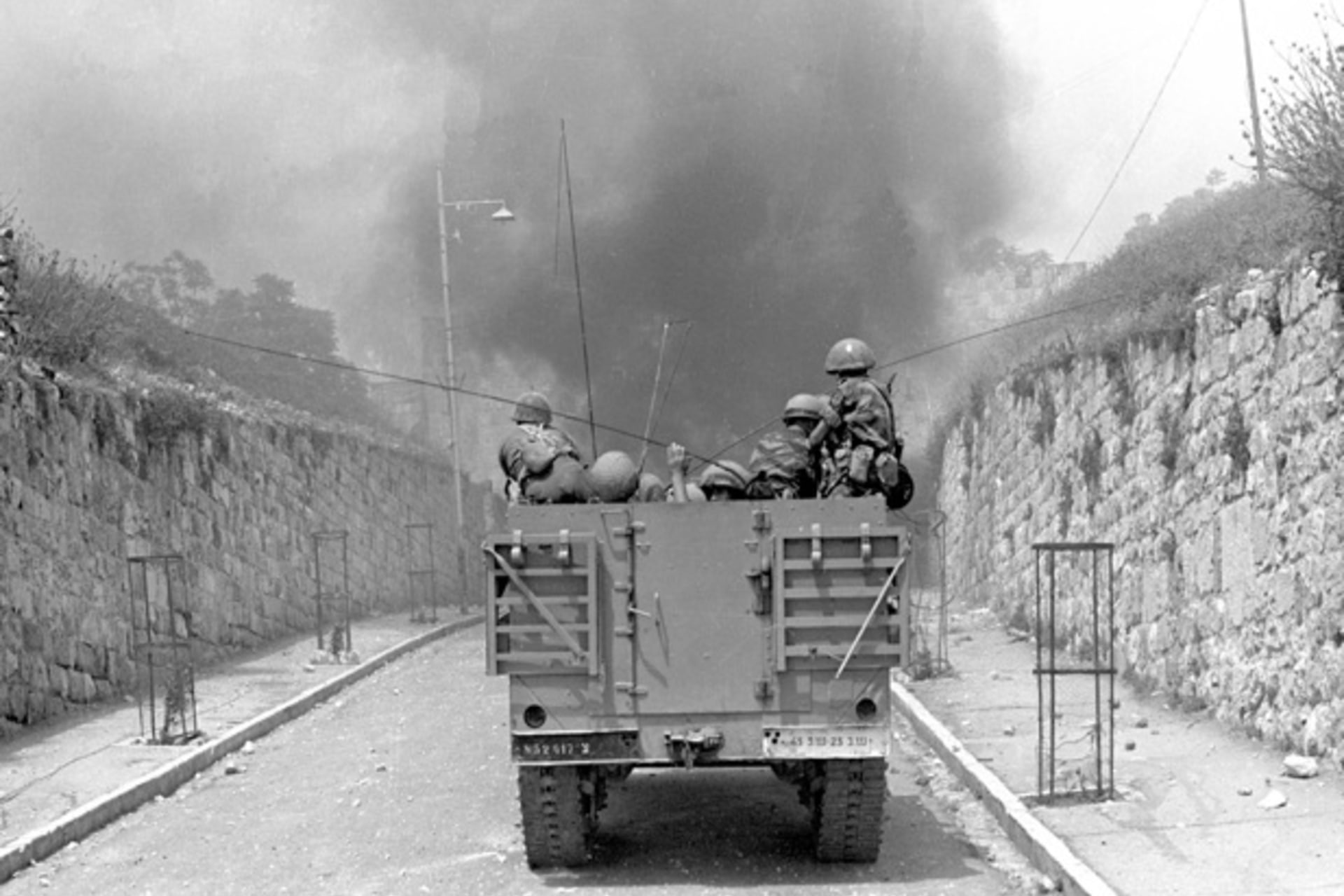 <p>An Israeli armoured vehicle drives towards the Lion’s Gate in the Old City of Jerusalem during the Six Day War in 1967 (Courtesy Reuters).</p>

