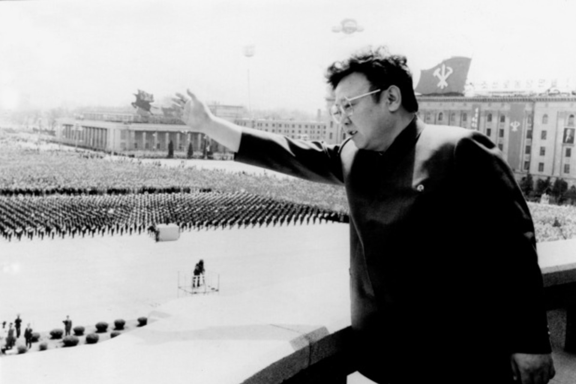 <p>The late North Korean leader Kim Jong-il waves to crowds in April 1992 (Courtesy Reuters/KCNA).</p>