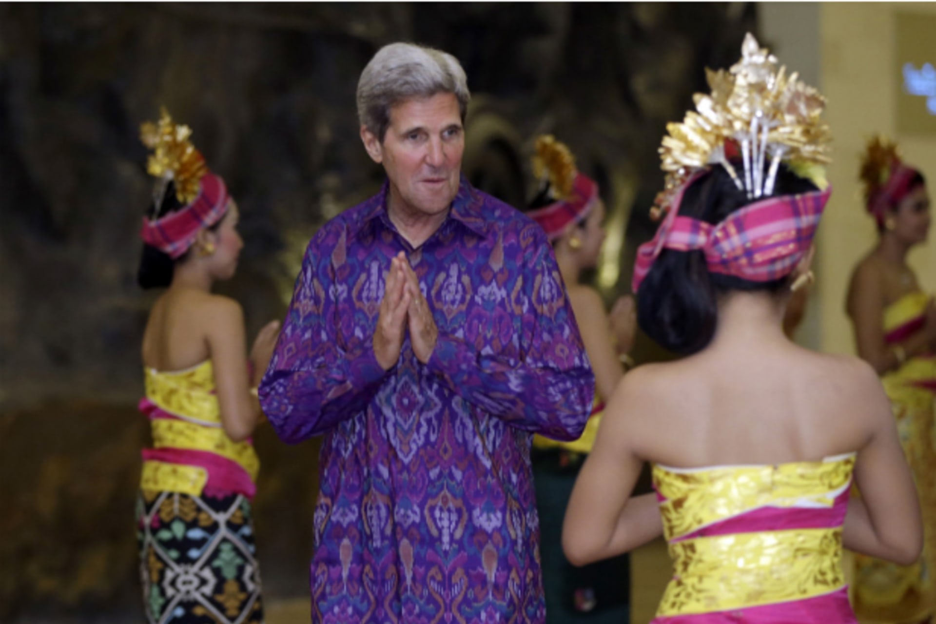 <p>U.S. Secretary of State John Kerry gestures as he arrives for the Asia-Pacific Economic Cooperation (APEC) Summit official dinner in Nusa Dua on the Indonesian resort island of Bali on October 7, 2013. (Pool New/Courtesy Reuters)</p>
