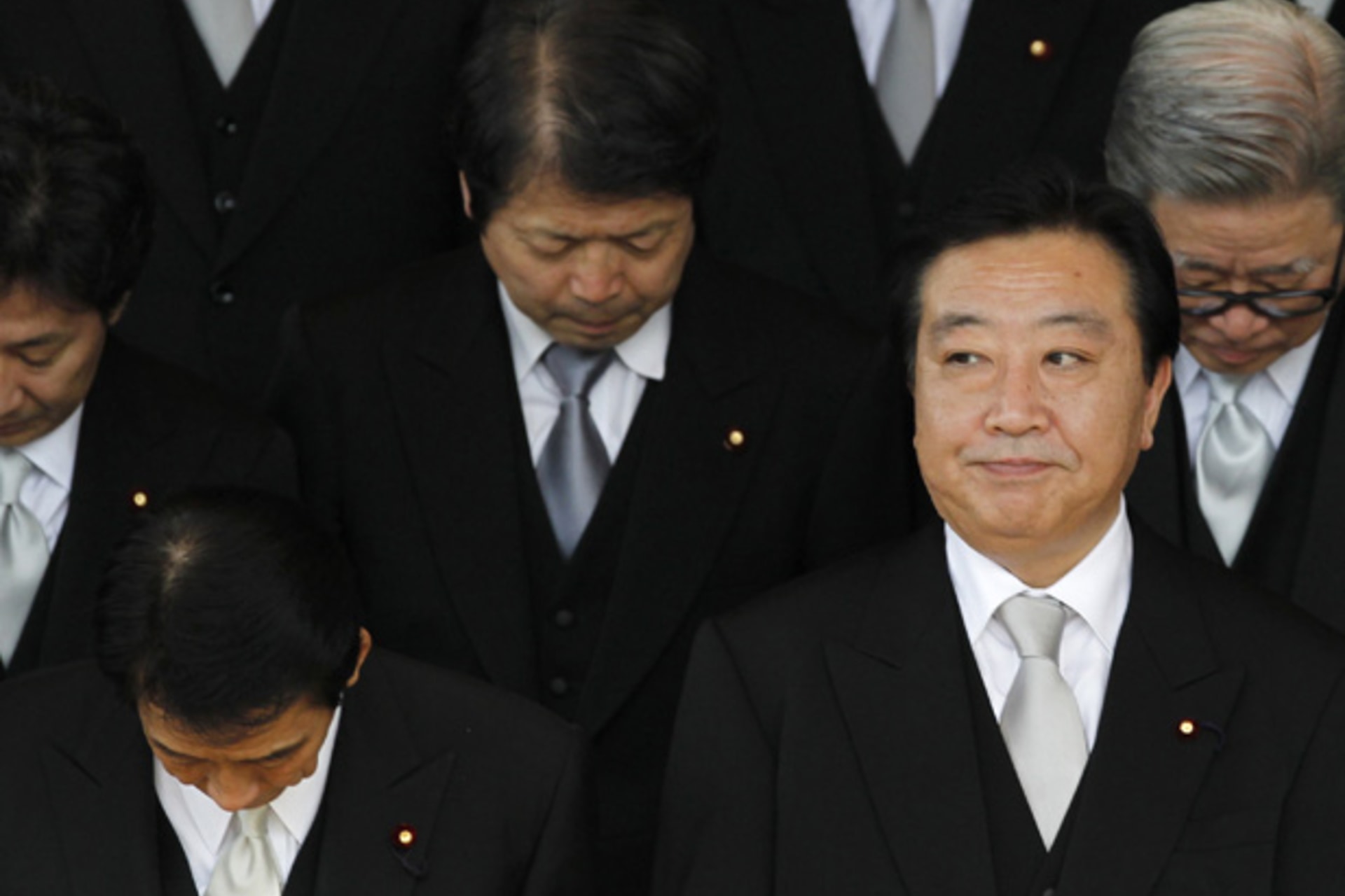 <p>Japan’s new Prime Minister Yoshihiko Noda (front R) and his cabinet members prepare to pose for a photo in Tokyo September 2, 2011.</p>
