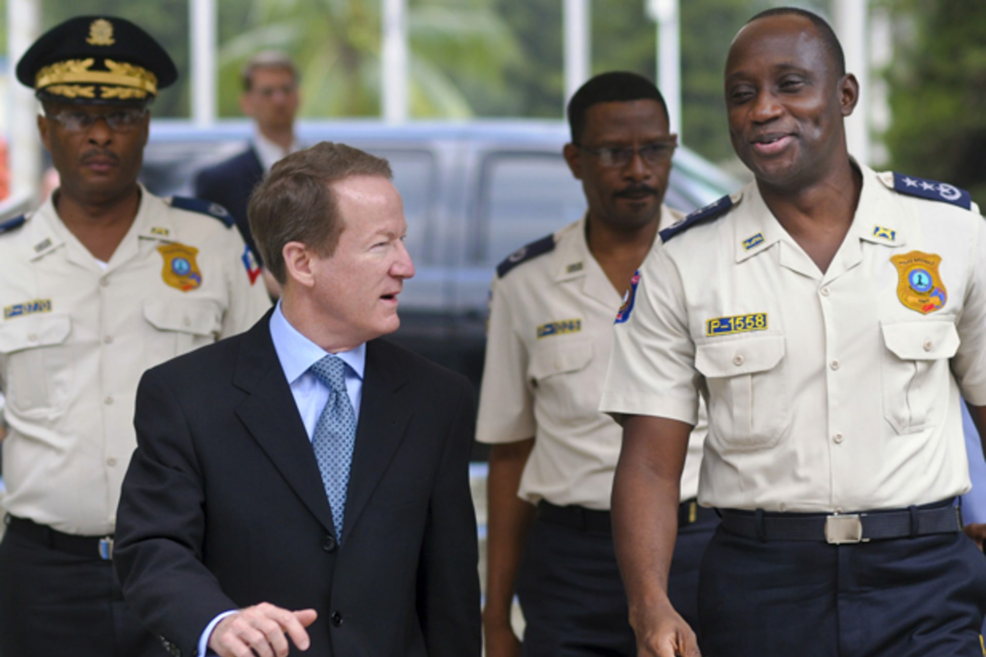 U.S. Assistant Secretary of State for International Narcotics and Law Enforcement Affairs William Brownfield speaks with Mario Andresol, director general of the Haitian Police Force, in Port-au-Prince