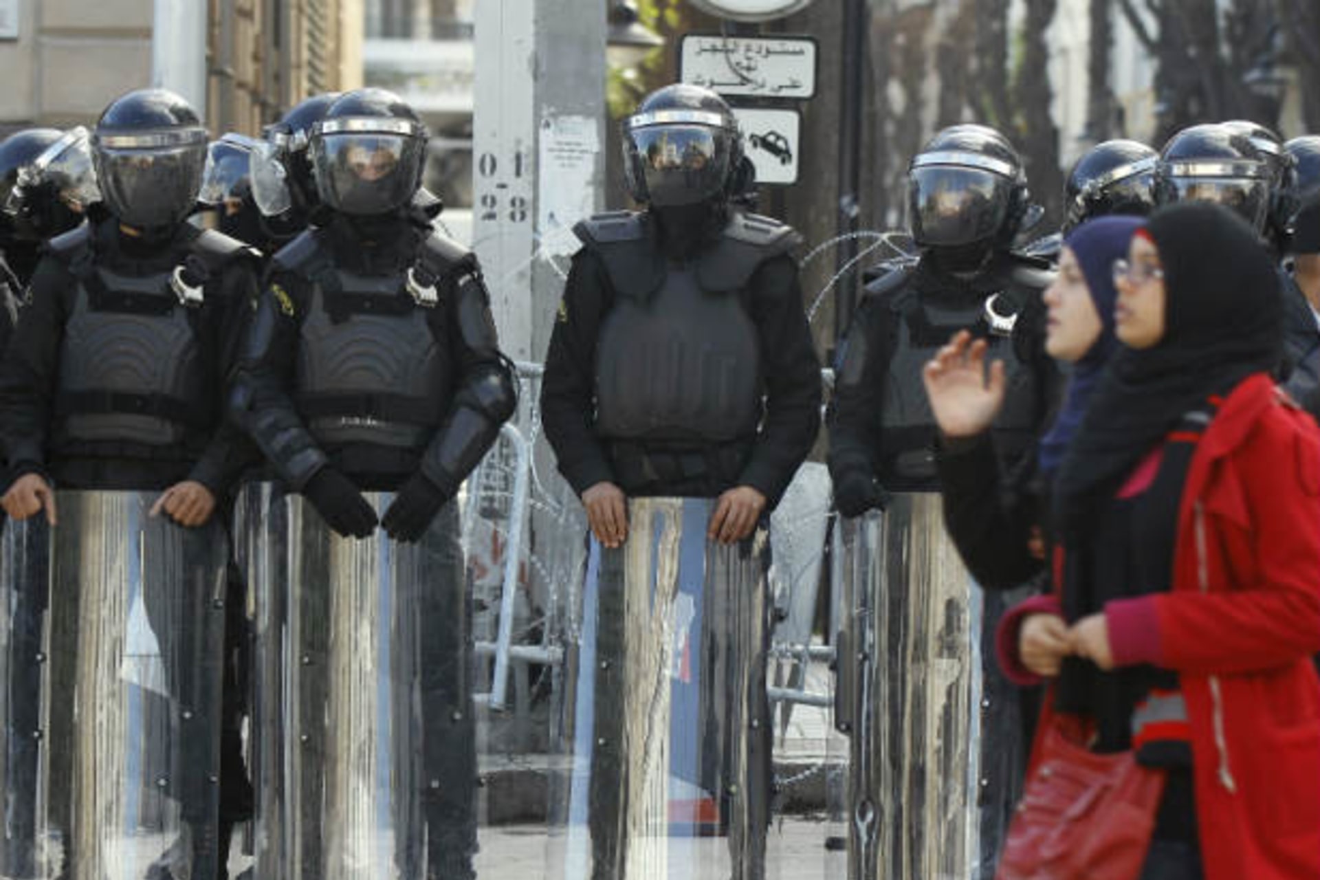 Riot police stand guard outside the French Embassy in Tunis on January 18, 2012, following the hostage-taking by Islamist militants in eastern Algeria (Mili/Courtesy Reuters).