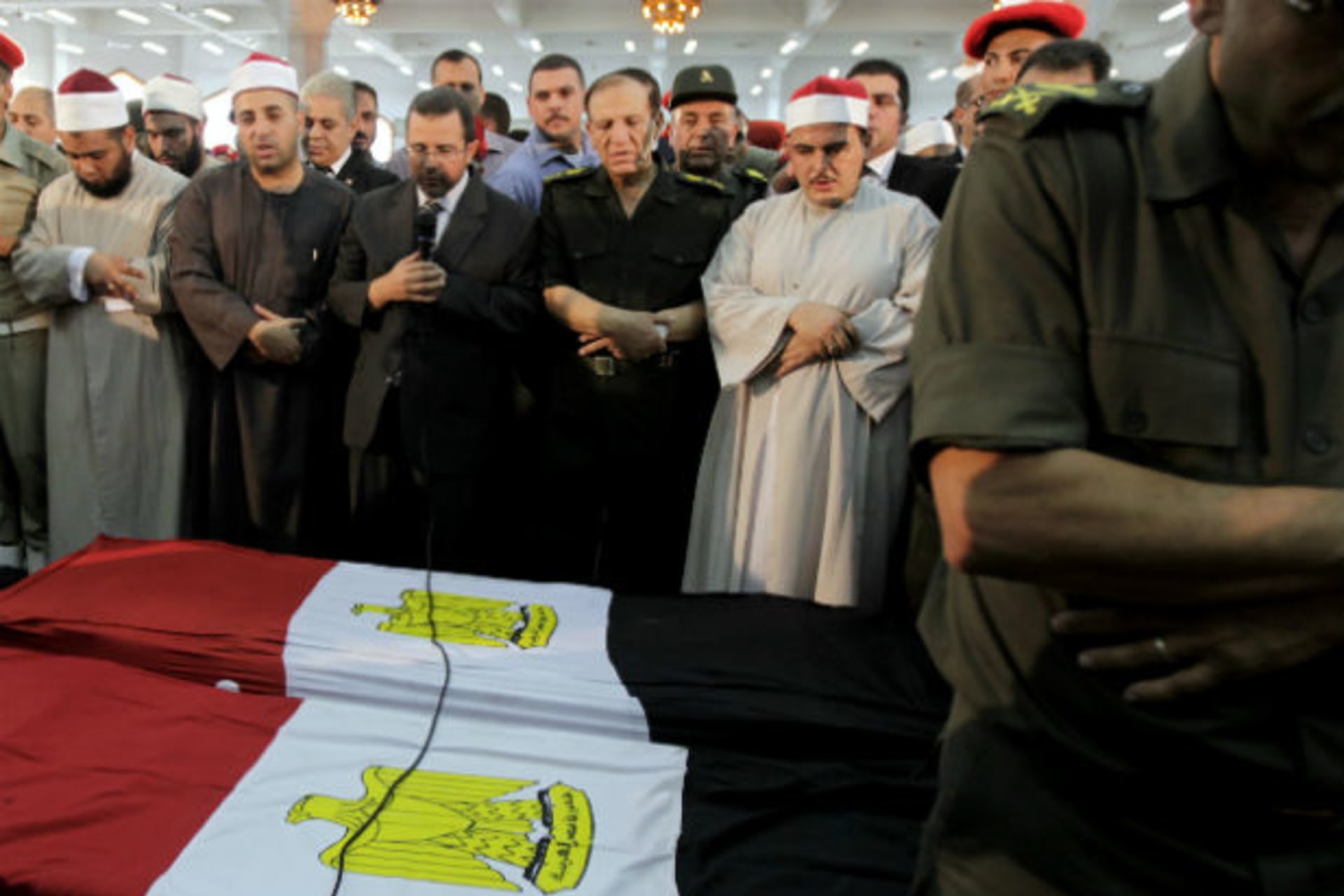 Egypt's prime minister Hisham Kandil prays for soldiers killed during an attack at a checkpoint along the Sinai border with Israel by unknown gunmen, at Omar Makram mosque in Cairo on August 7, 2012 (Mohamed Abd El Ghany/Courtesy Reuters).
