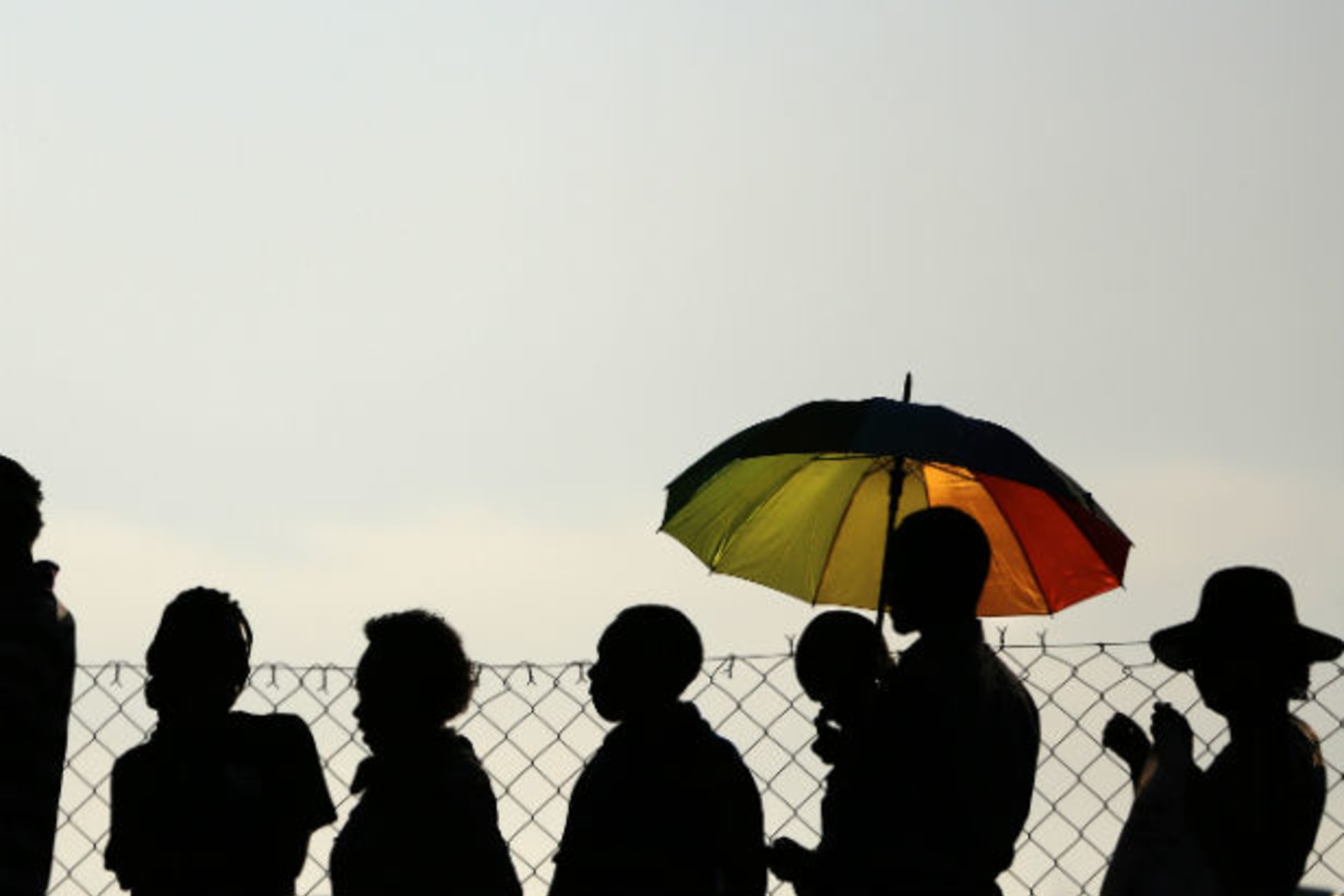 People wait in a bus line to pay their respects to former South African President Nelson Mandela in Pretoria December 13, 2013.