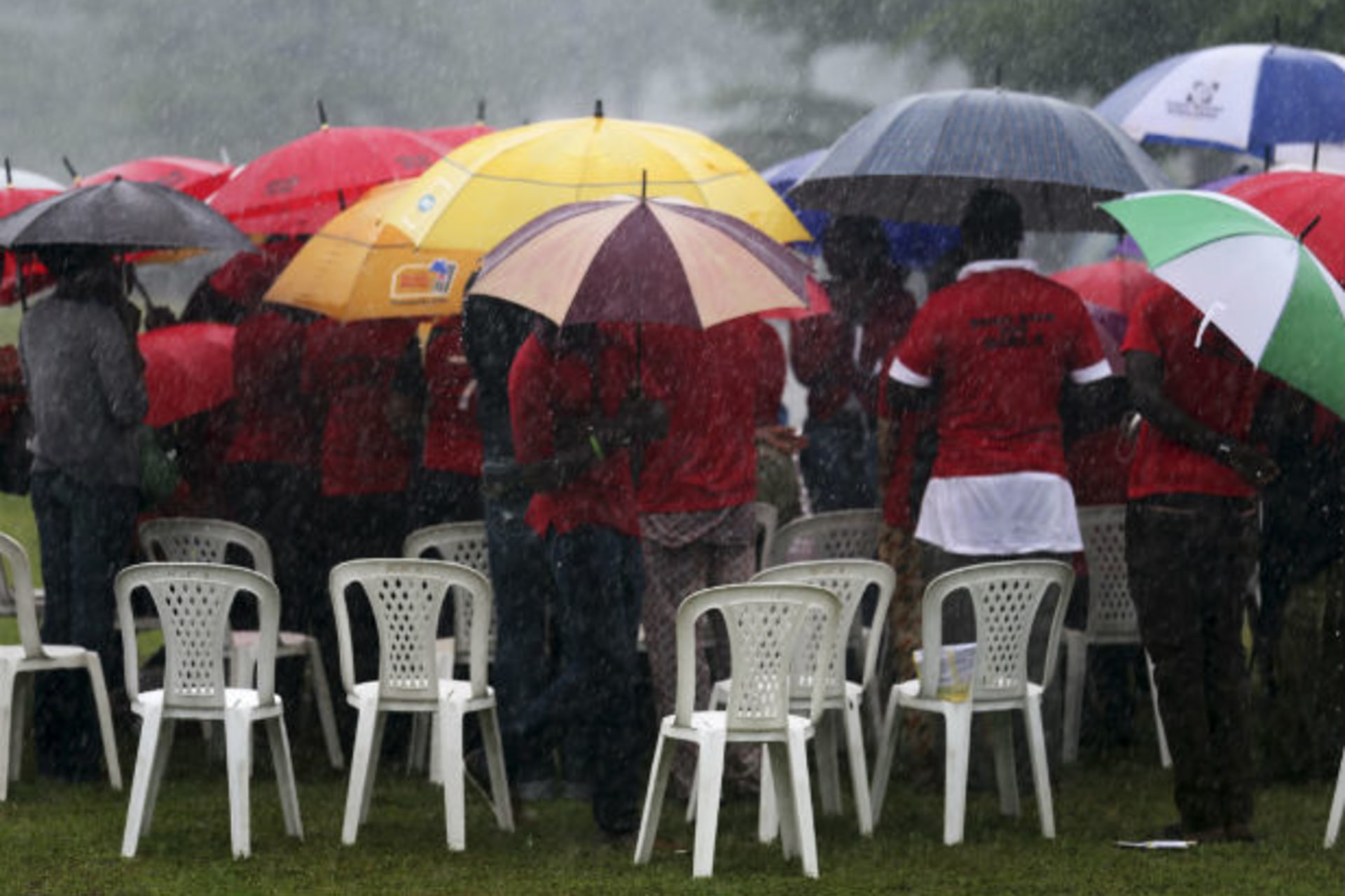 Campaigners attend a speak-out session for the "Bring Back Our Girls" campaign in the rain near Nigeria's Lagos Marina July 5, 2014.