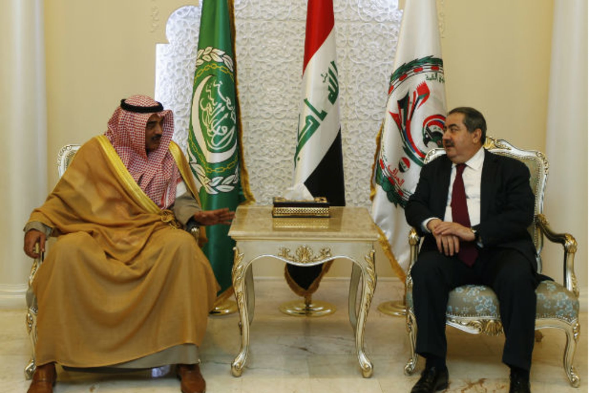 Iraq's foreign minister Hoshyar Zebari meets with his Kuwaiti counterpart sheikh Sabah Khalid Al-Hamad Al-Sabah upon his arrival for the Arab foreign ministers meeting as part of the Arab League Summit in Baghdad on March 28, 2012 (Mohammed Ame