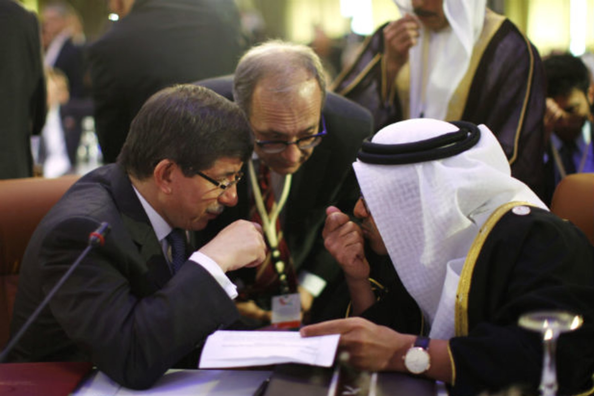Turkey's foreign minister Ahmet Davutoglu confers with United Arab Emirates' foreign minister Sheikh Abdullah bin Zayed al-Nahyan during the “Friends of Syria” conference in Tunis on February 24, 2012 (Jason Reed/Courtesy Reuters).