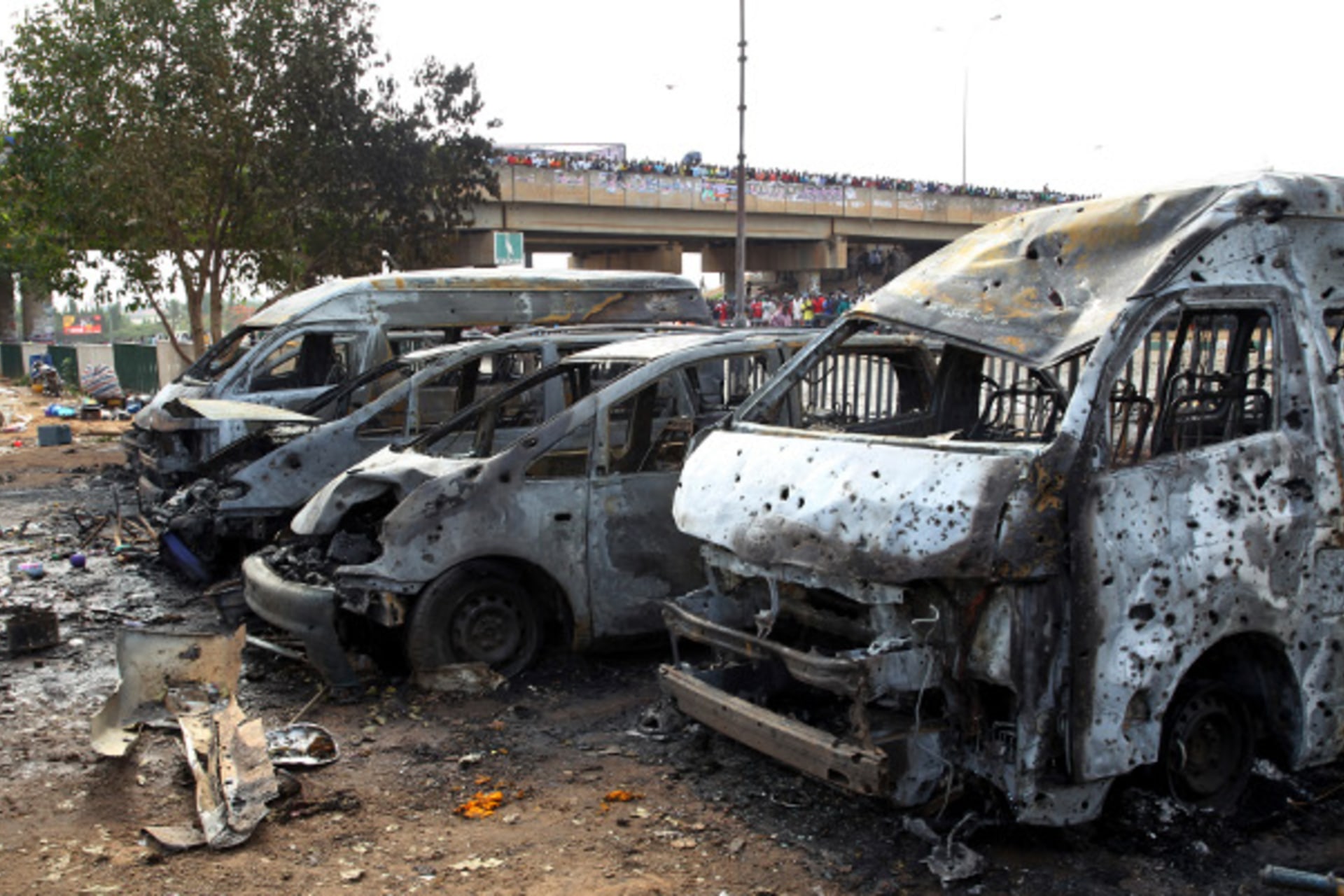 Burnt and damaged vehicles are seen at the scene of the bomb blast explosion at Nyanyan, Abuja April 14, 2014.