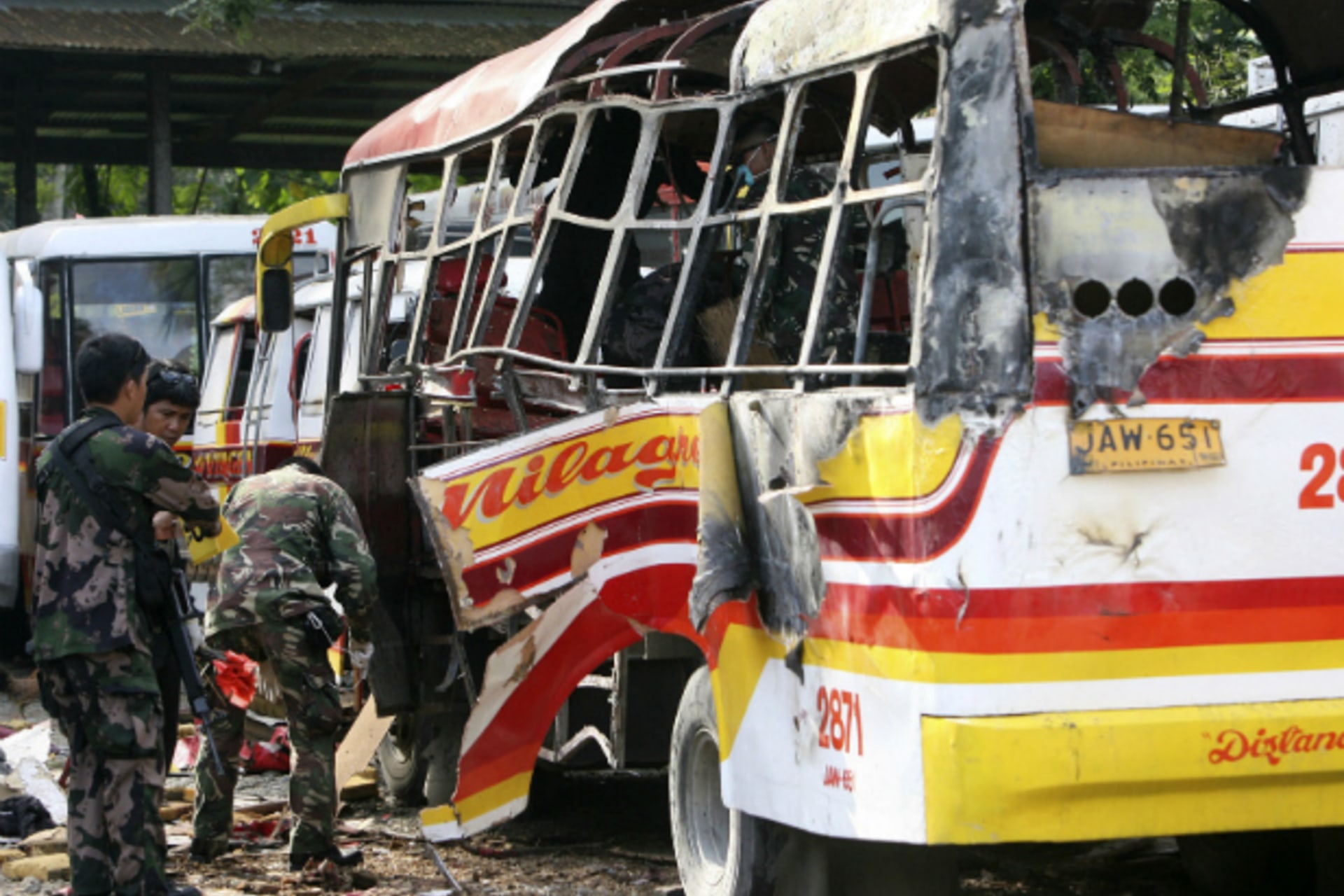 <p>Police and military bomb experts search for fragments and residue after a bomb exploded and ripped through a passenger bus, ki…at has already killed more than a hundred and left scores of others wounded, local media reported. (Stringer/Courtesy Reuters)</p>
