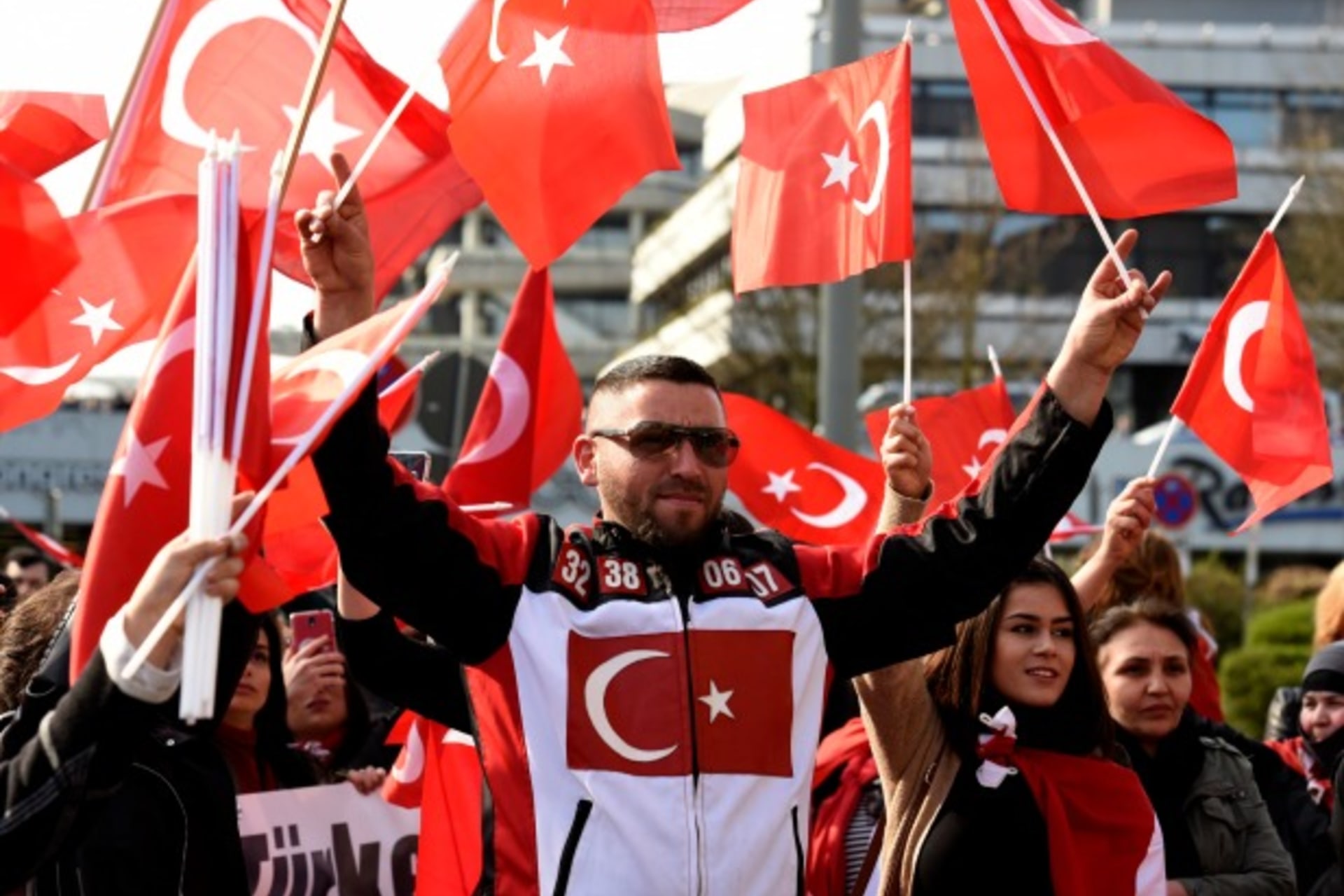 <p>Pro-Turkish protestors hold Turkish national flags as they take part in a demonstration in Hamburg (Fabian Bimmer/Reuters).</p>
