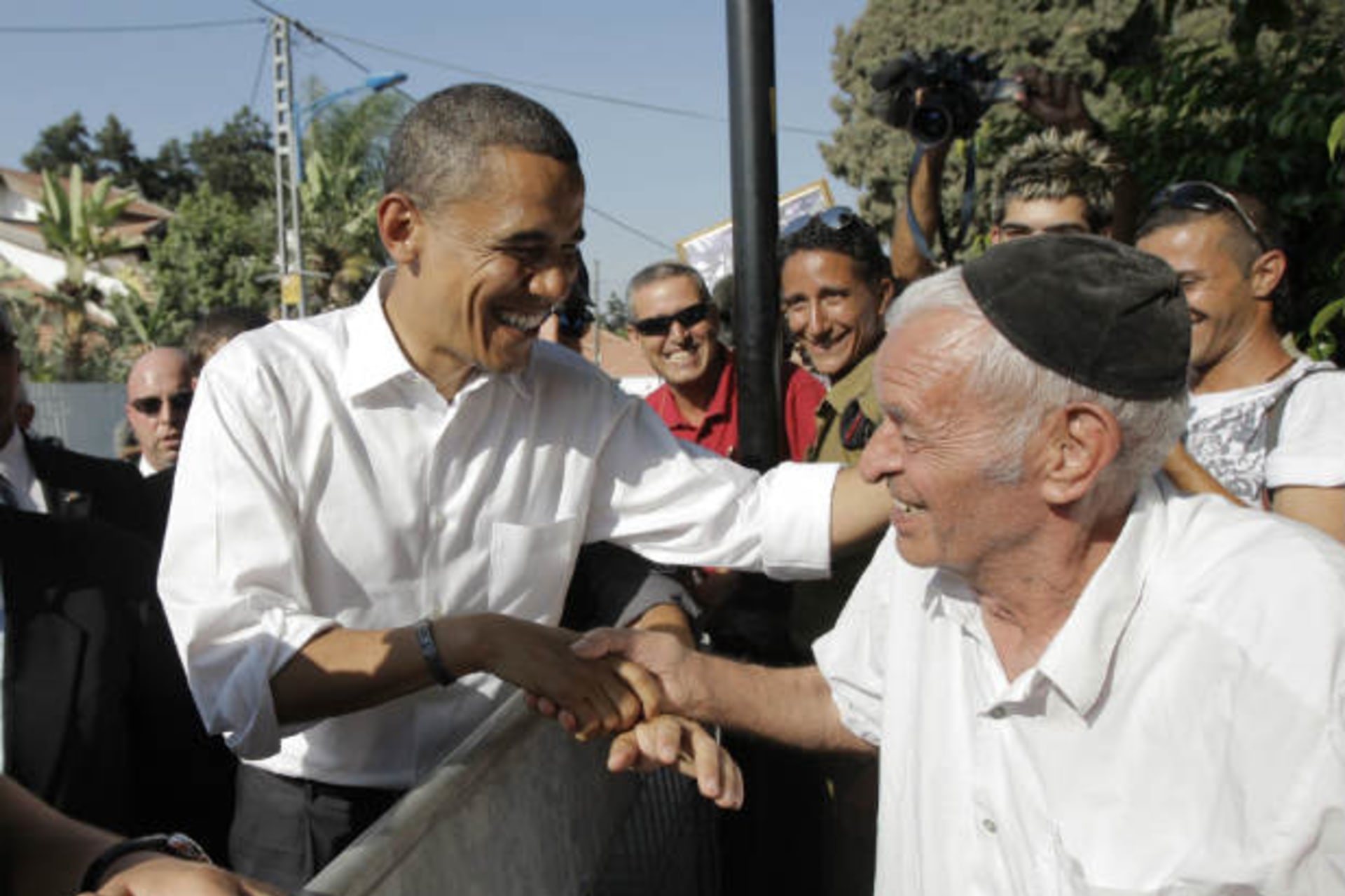 U.S. democratic presidential candidate Barack Obama shakes hands with an elderly Israeli man during his visit to Sderot on July 23, 2008 (Hong/Courtesy Reuters).
