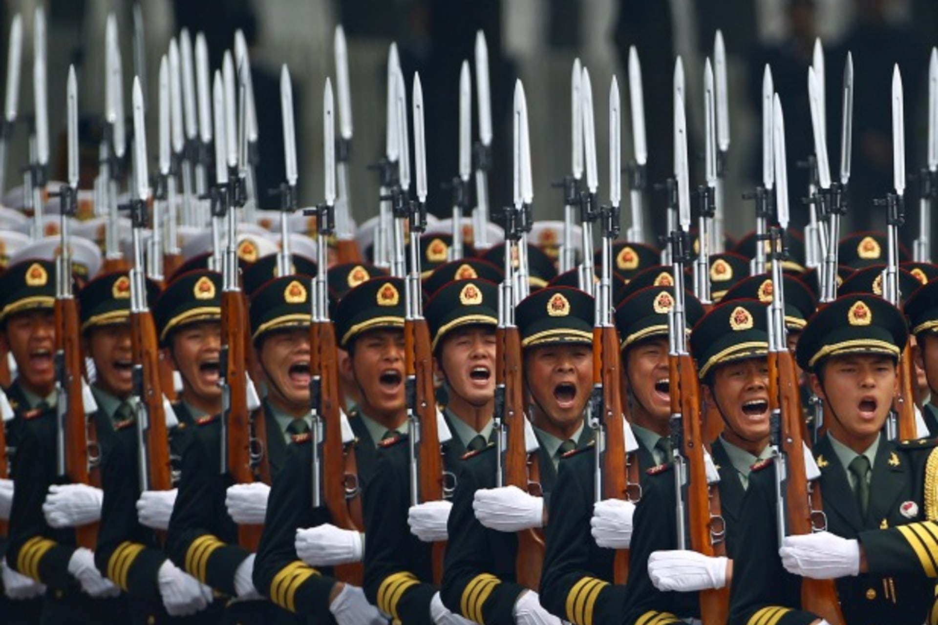 <p>Honour guard troops march during a welcoming ceremony for visiting Palestinian President Mahmoud Abbas outside the Great Hall of the People in Beijing on May 6, 2013. (Petar Kujundzic/Courtesy Reuters)</p>
