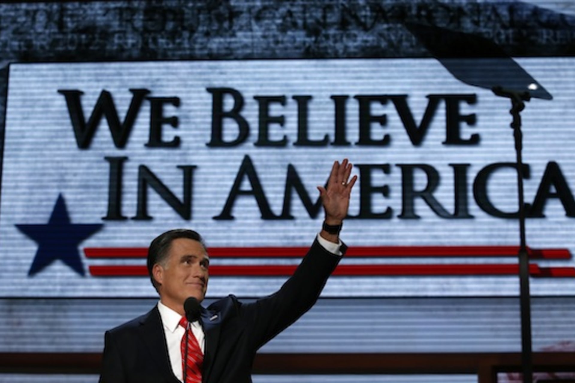 <p>Mitt Romney waves as he arrives onstage to accept the nomination during the Republican National Convention in Tampa. (Adrees Latif/ courtesy Reuters)</p>
