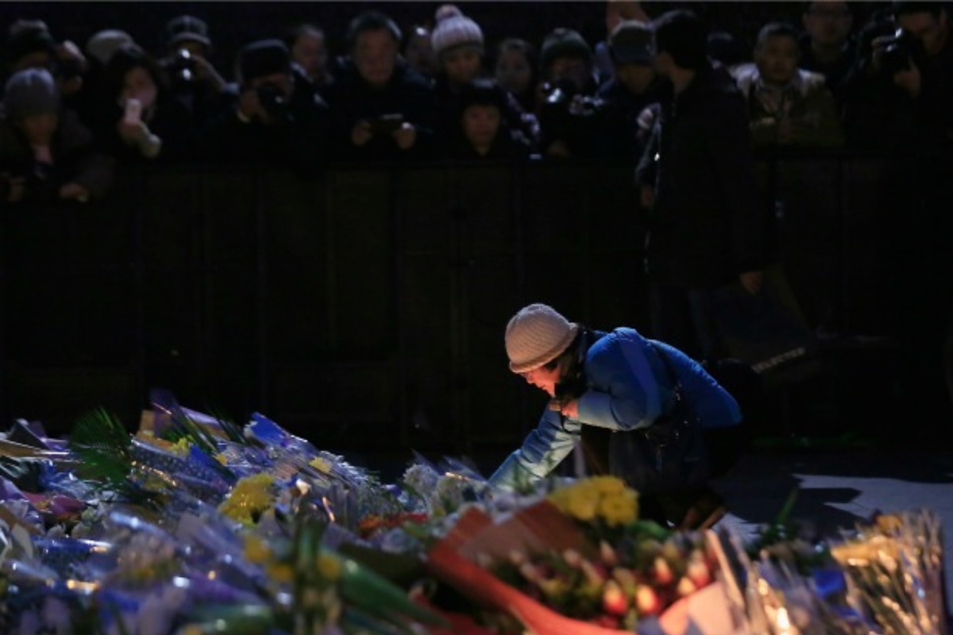 <p>A woman lights a candle during a memorial ceremony for people who were killed in a stampede incident during a New Year’s celeb… fake money thrown from a building overlooking the city’s famous waterfront. REUTERS/Aly Song (CHINA – Tags: DISASTER SOCIETY)</p>

