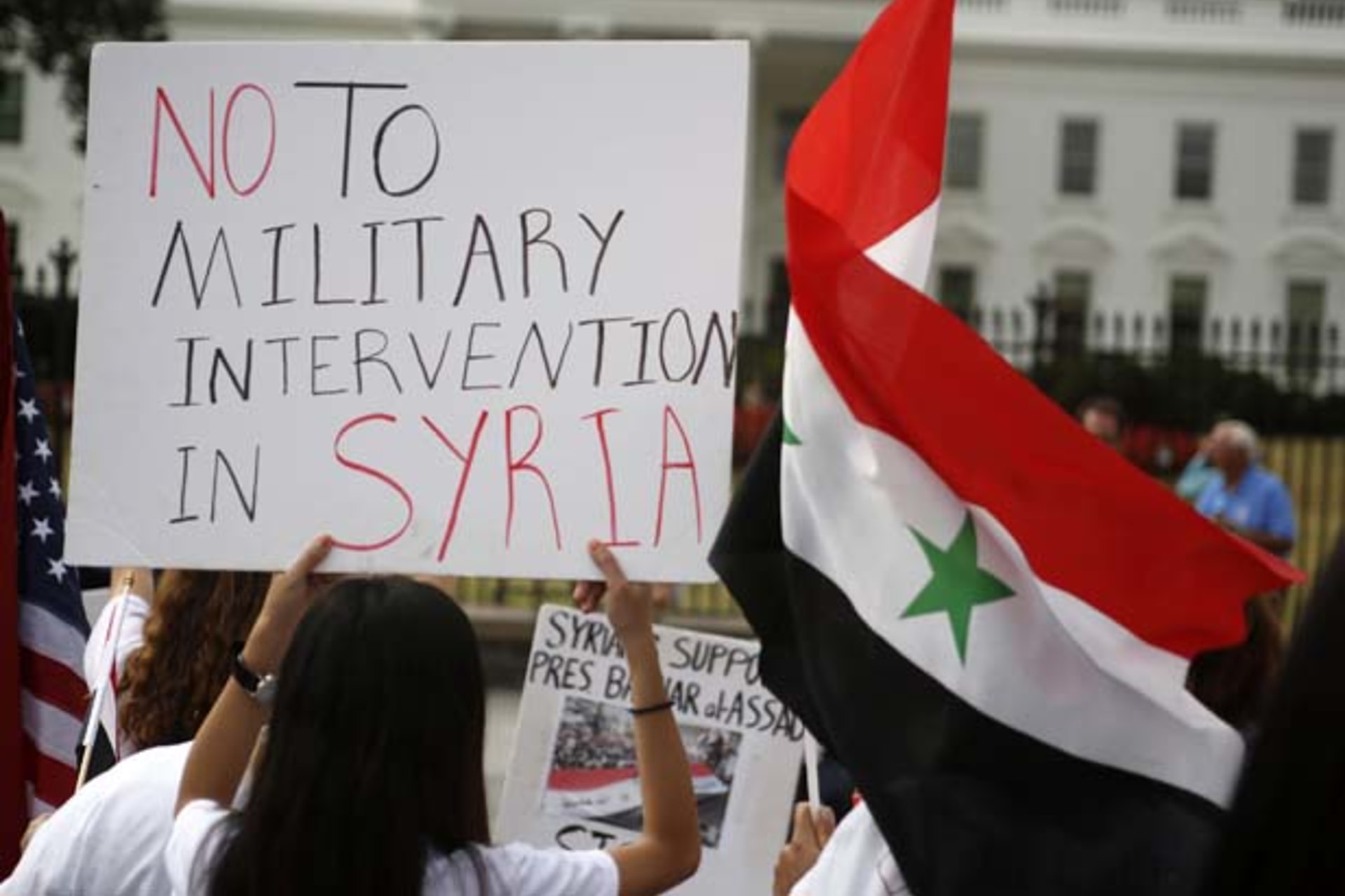 <p>Syrian-American demonstrators protest in front of the White House (Jim Bourg/Courtesy Reuters).</p>
