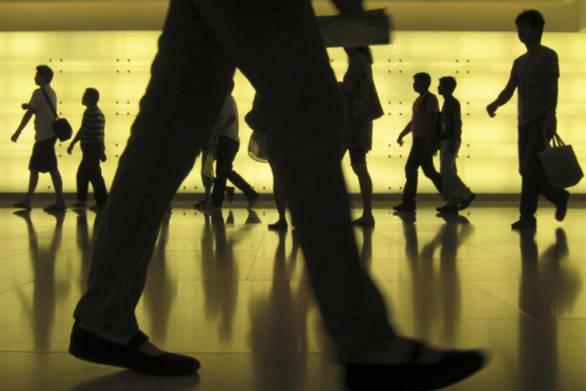 <p>People walk through Ion, a mall on Orchard Road in Singapore on May 7, 2011. The mall has many stores located underground. (Russell Boyce/Courtesy Reuters)</p>
