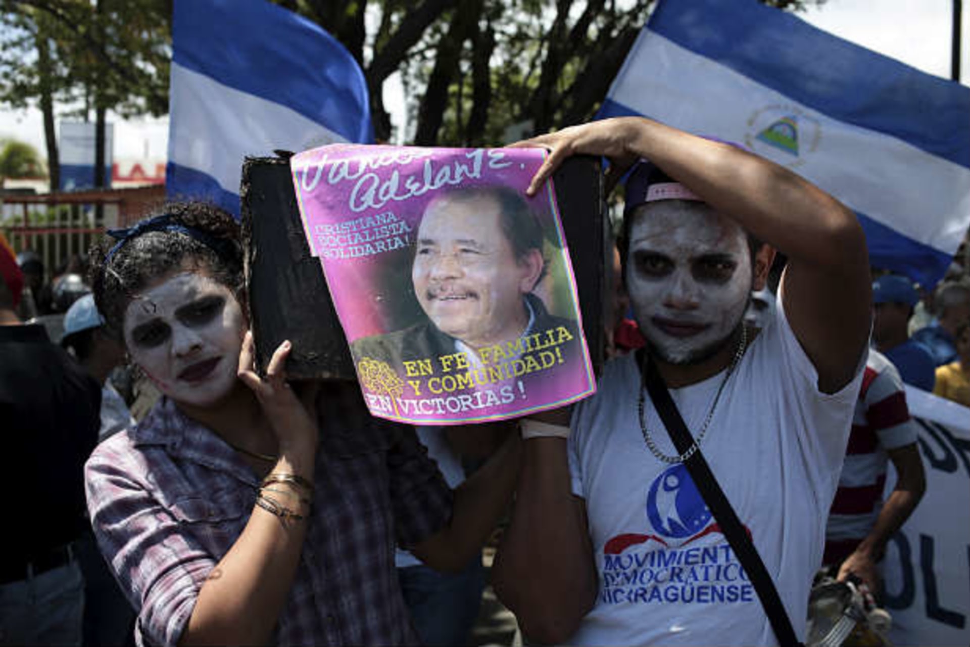 <p>Opposition supporter holds a poster of Nicaragua’s President Daniel Ortega during a protest demanding fairer presidential elections next year, in Managua, Nicaragua. (Oswaldo Rivas/Courtesy Reuters)</p>
