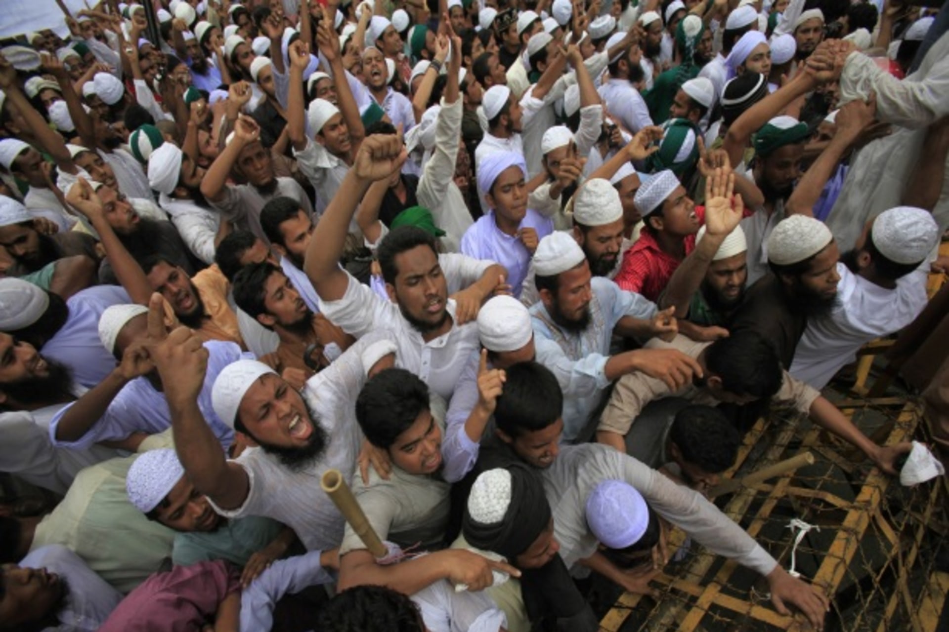 <p>Bangladeshi Muslims attempt to break a police barricade during a protest in Dhaka on September 14, 2012 (Andrew Biraj/Courtesy Reuters).</p>
