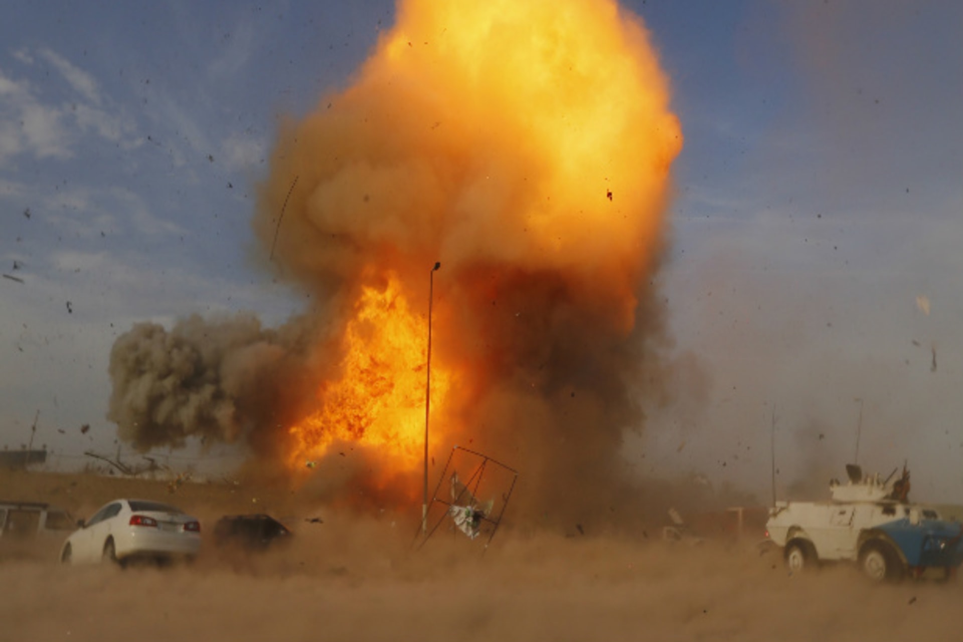 An explosion is seen during a car bomb attack at a Shi'ite political organization's rally in Baghdad, April 25, 2014 (al-Sudani/Courtesy Reuters).