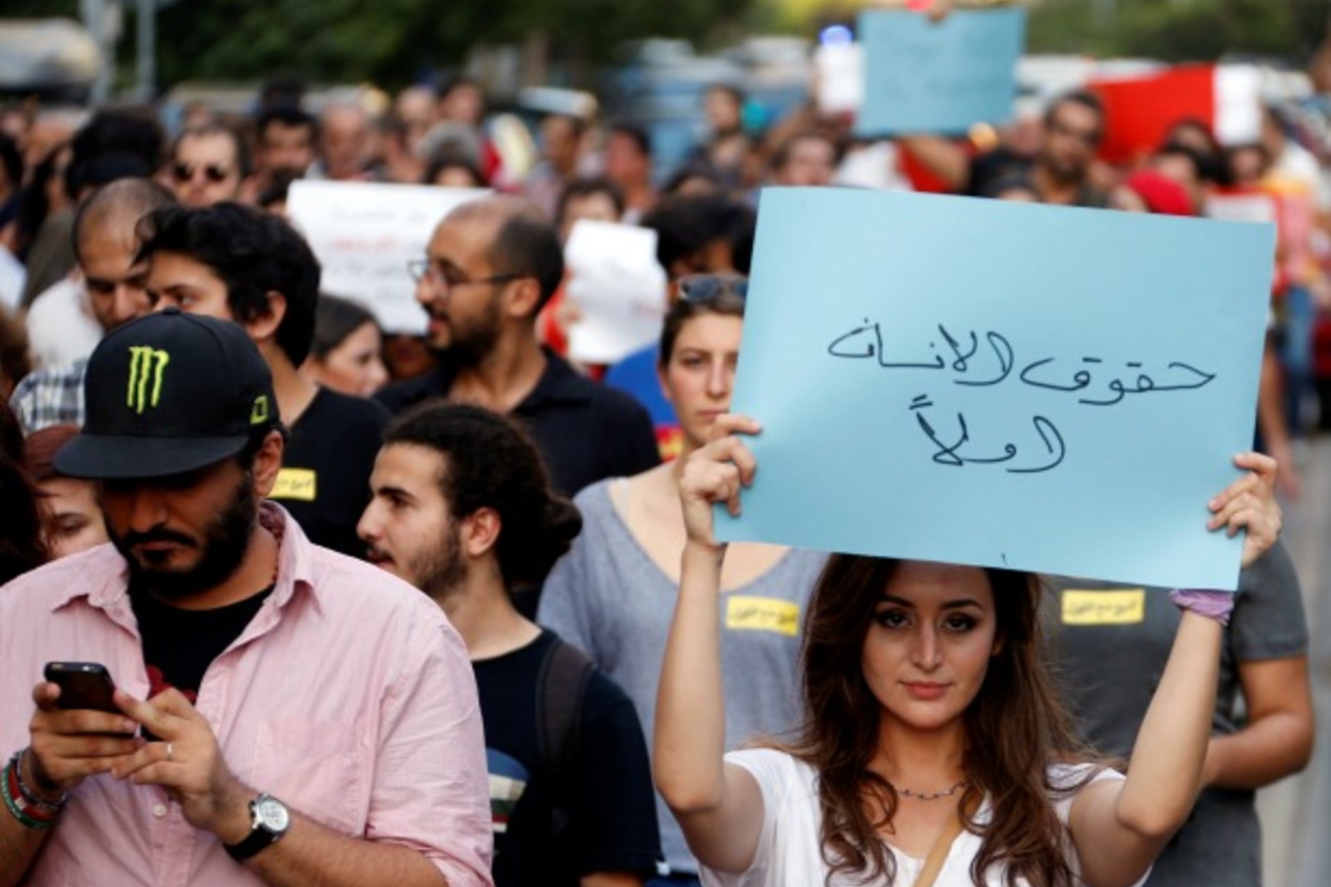 <p>People attend a demonstration against sectarianism, also calling for abolishing curfews put on Syrian refugees in Beirut, Lebanon (Mohamed Azakir/Reuters).</p>
