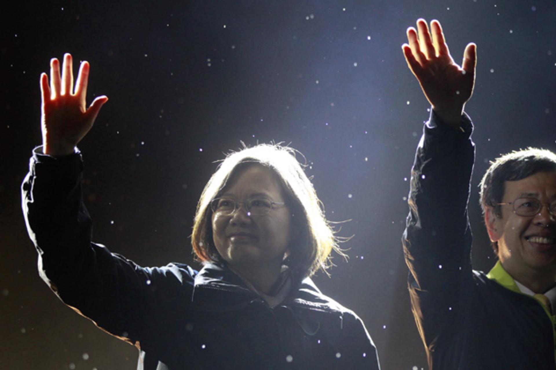 Taiwan's Democratic Progressive Party Chairperson and presidential candidate Tsai Ing-wen and vice presidential candidate Chen Chien-jen greet supporters during a final campaign rally ahead of the elections in Taipei
