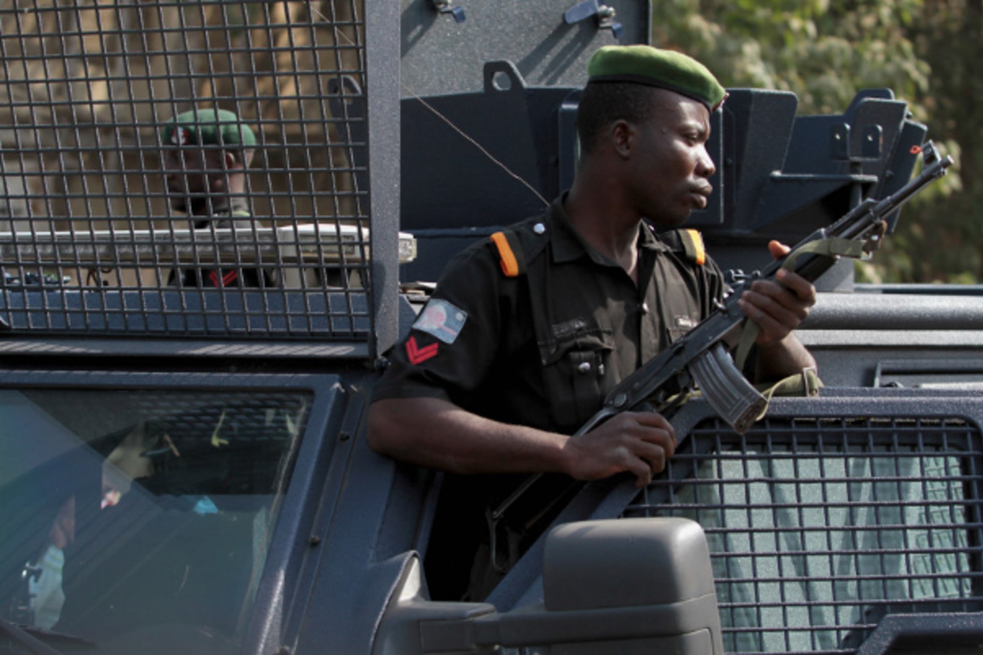 A police officer keeps watch during a protest against the elimination of a popular fuel subsidy that has doubled the price of petrol, in Nigeria's capital Abuja January 9, 2012. r armed
