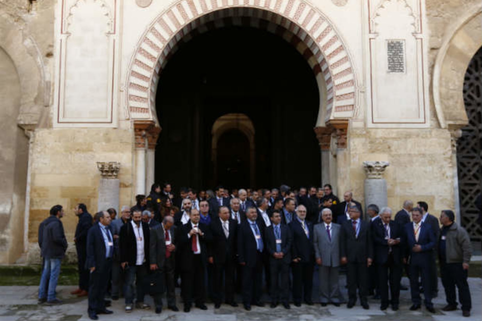 Members of Syrian opposition groups stand after visiting the former mosque of Cordoba during a consultative meeting in Cordoba, southern Spain January 9, 2014 (del Pozo/Courtesy Reuters).