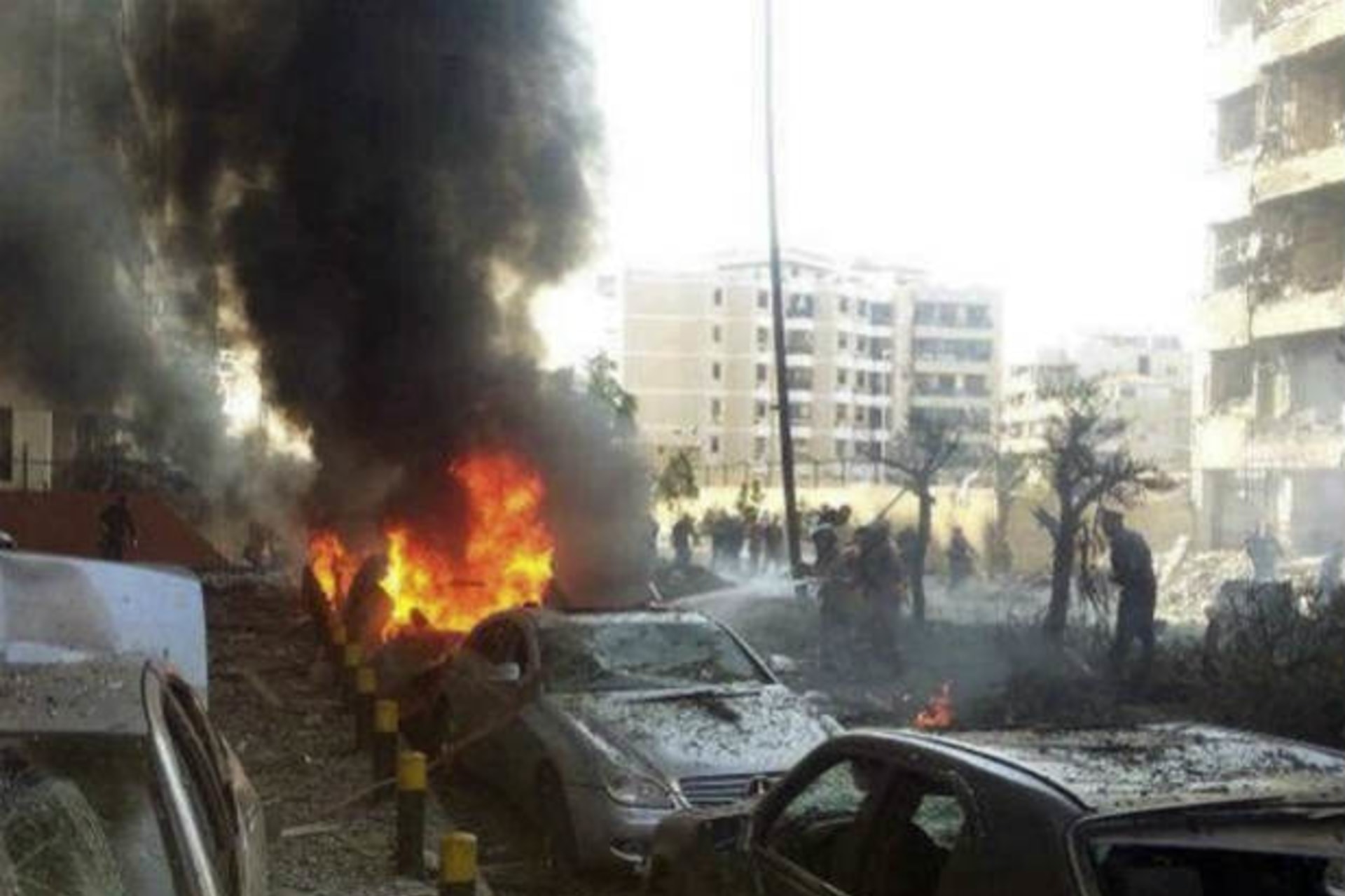 <p>Civil Defence personnel extinguish a fire on cars at the site of the explosions near the Iranian embassy in Beirut November 19, 2013 (Yassine/Courtesy Reuters).</p>
