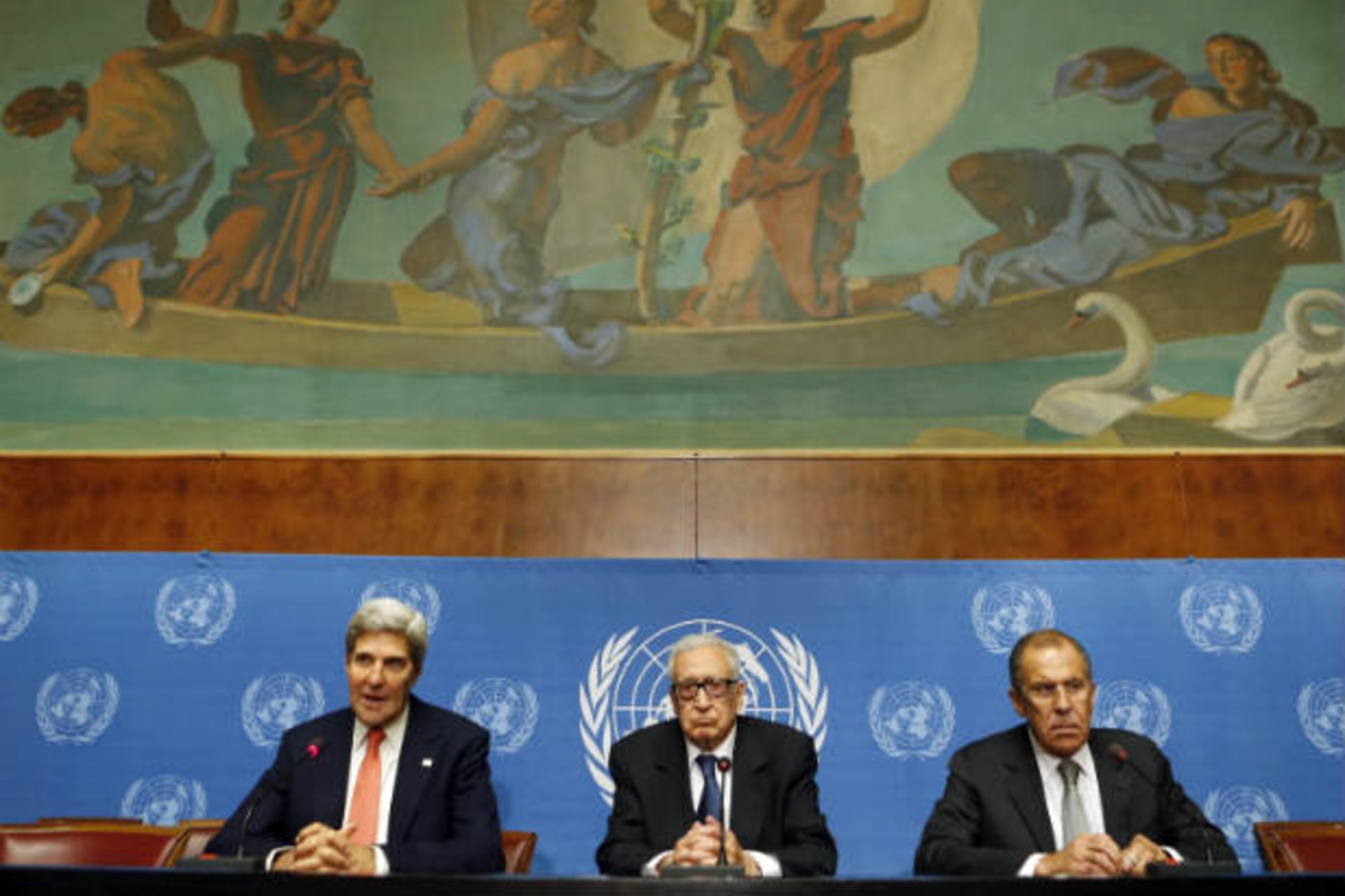 U.S. Secretary of State John Kerry (L) speaks next to U.N. Special Representative Lakhdar Brahimi (C) and Russian Foreign Minister Sergei Lavrov after a meeting discussing the ongoing problems in Syria at the United Nations offices in Geneva Se
