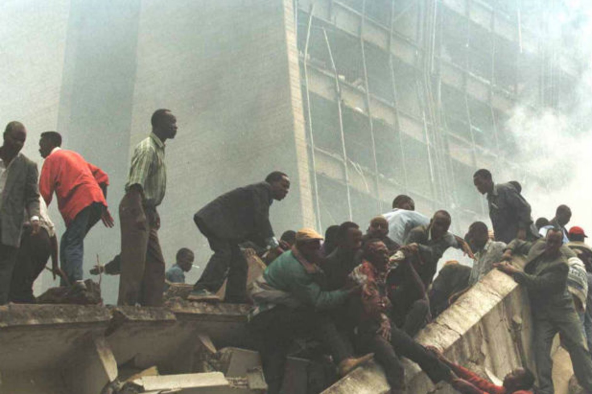 An injured man is removed from the wreckage after a bomb went off in Nairobi August 7. August 8, 1998. (Courtesy Reuters)