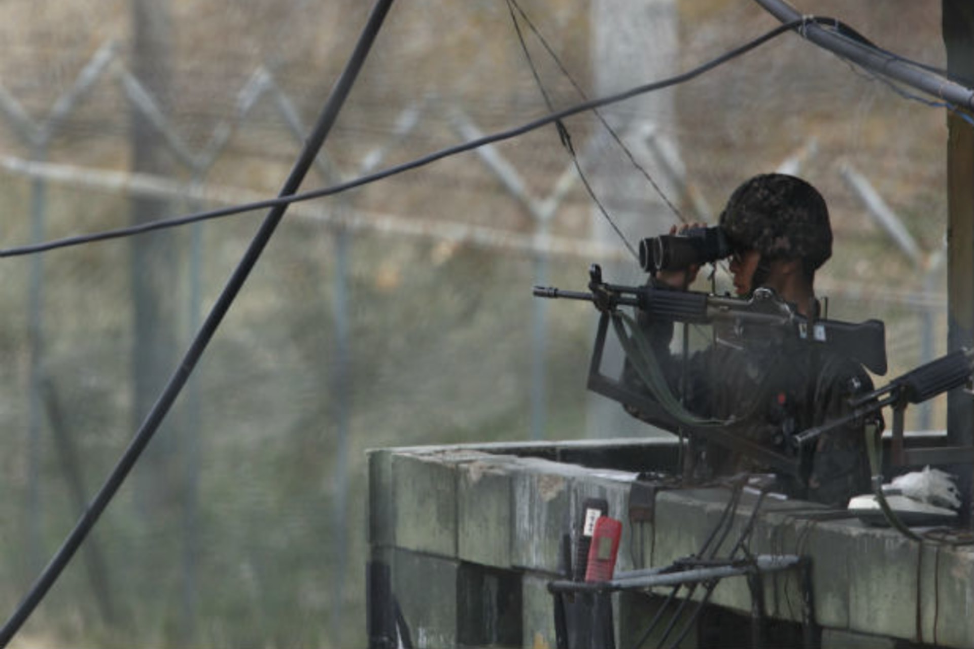 <p>A South Korean soldier looks to the north near the demilitarized zone. (Kim Hong-Ji/Courtesy Reuters).</p>
