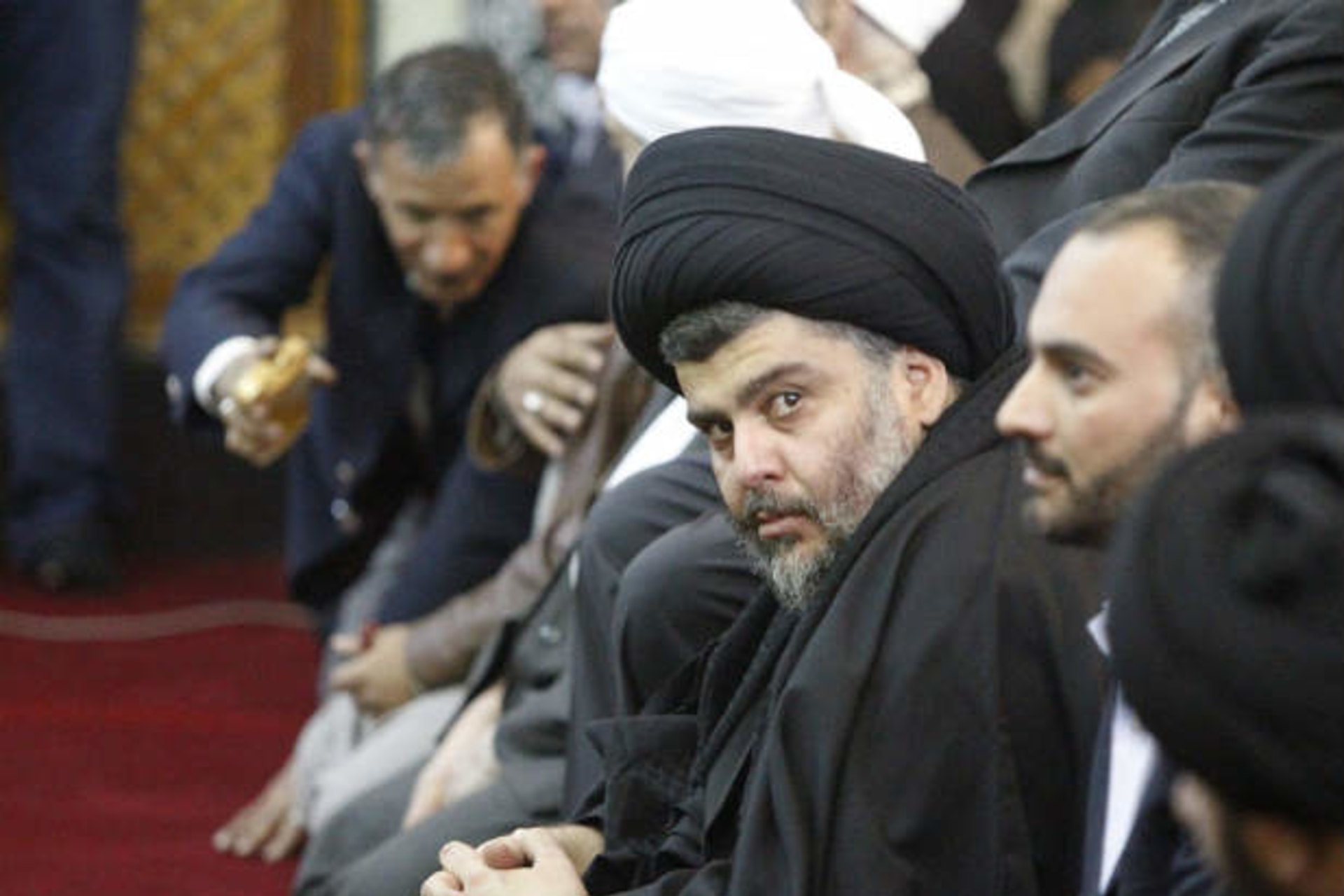 Iraqi Shi'ite cleric Sadr takes part in Friday prayers participated by Sunni and Shi'ite Muslim worshippers in a gesture of unity at the Abdul Qadir Gilani Mosque in Baghdad on January 4, 2012 (Al-Sudani/Courtesy Reuters).