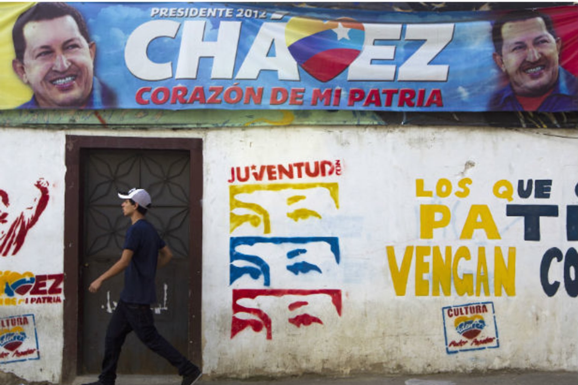 A man walks past a mural depicting Venezuelan President Hugo Chavez in Caracas (Carlos Garcia Rawlins/Courtesy Reuters).
